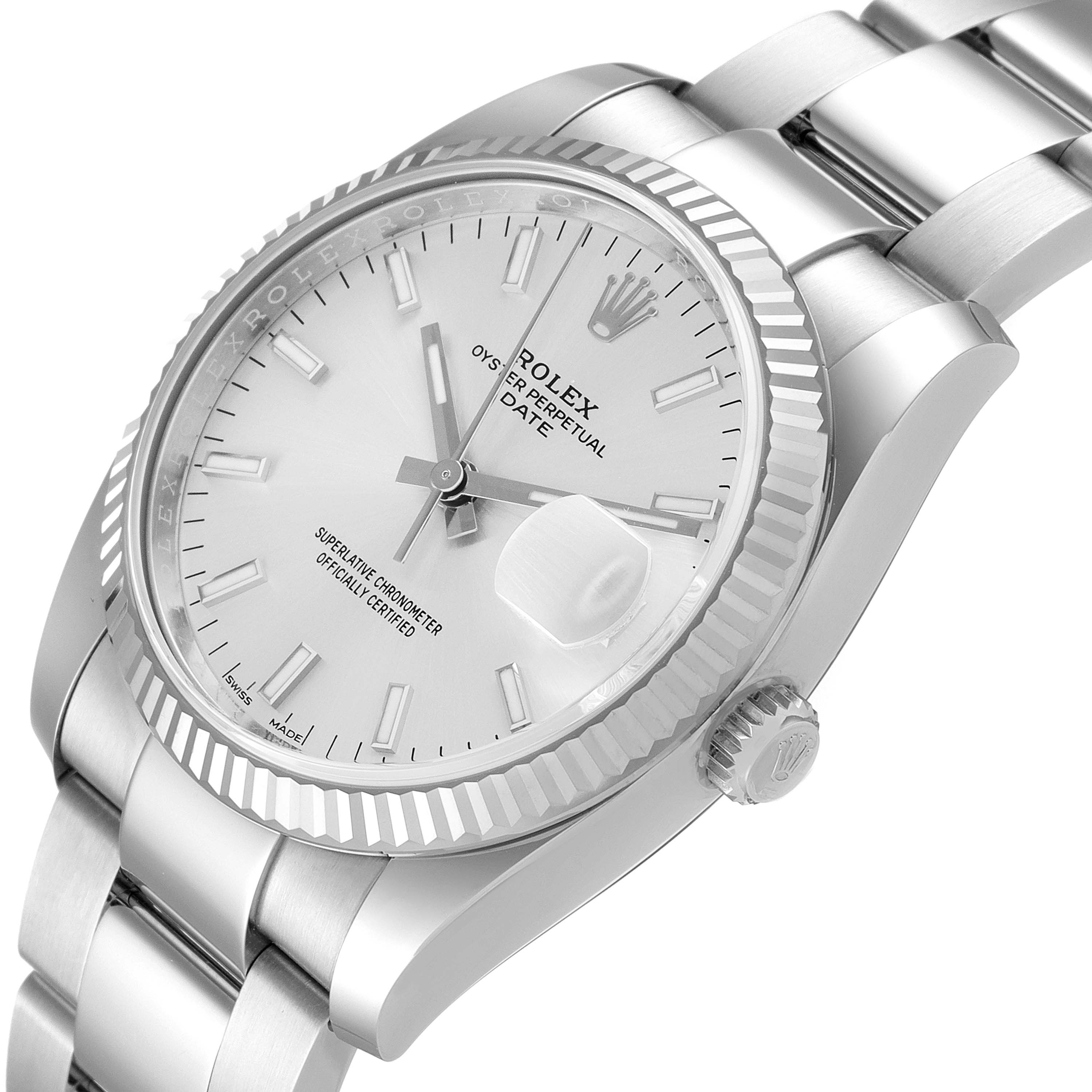 The image shows a side and close-up angle of the Rolex Date 115234 Men's Stainless Steel Silver Dial 115234 Men's Stainless Steel Silver Dial model, highlighting the dial, bezel, crown, and bracelet.