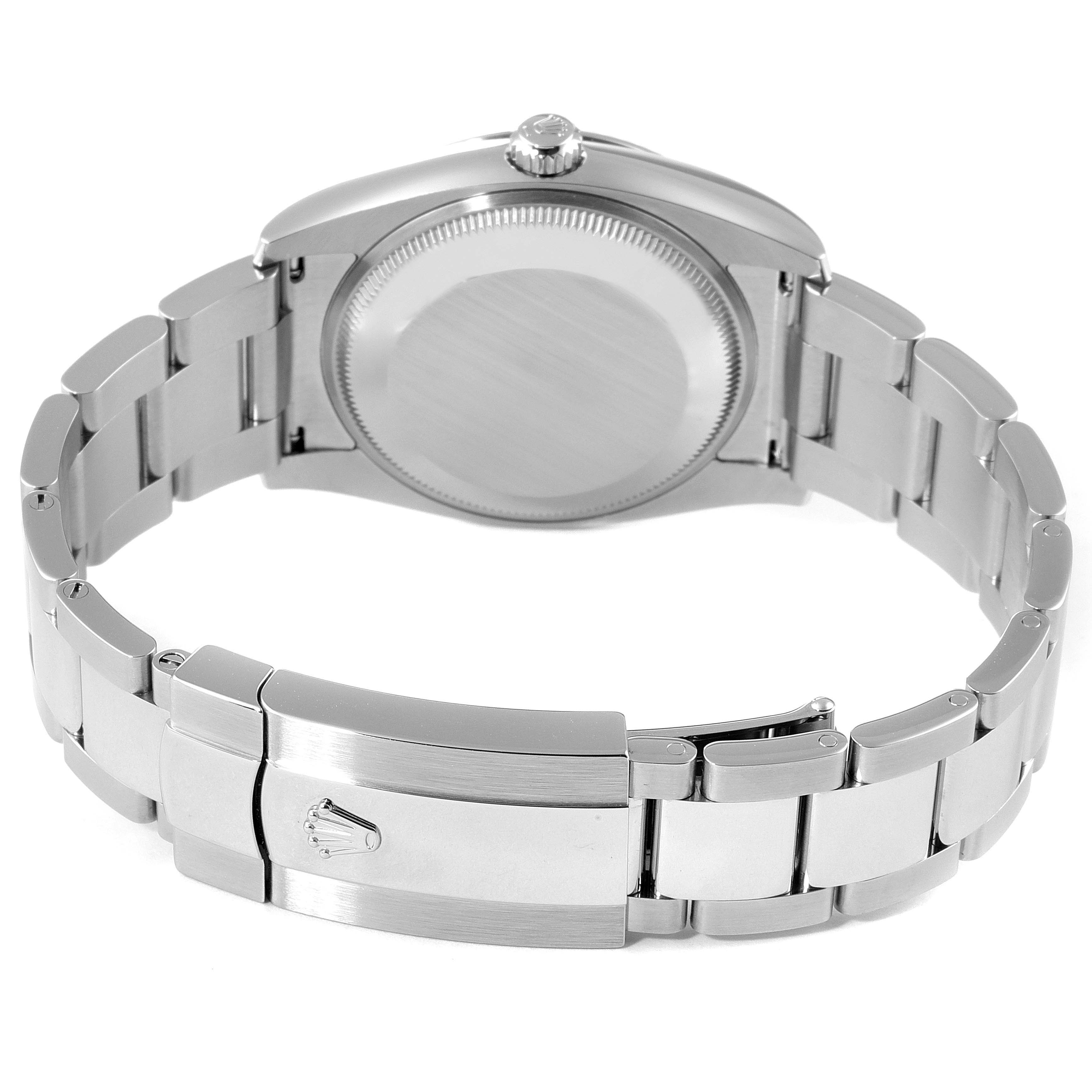 This image shows the backside of the Rolex Date 115234 Men's Stainless Steel Silver Dial 115234 Men's Stainless Steel Silver Dial model watch, highlighting the bracelet and clasp.