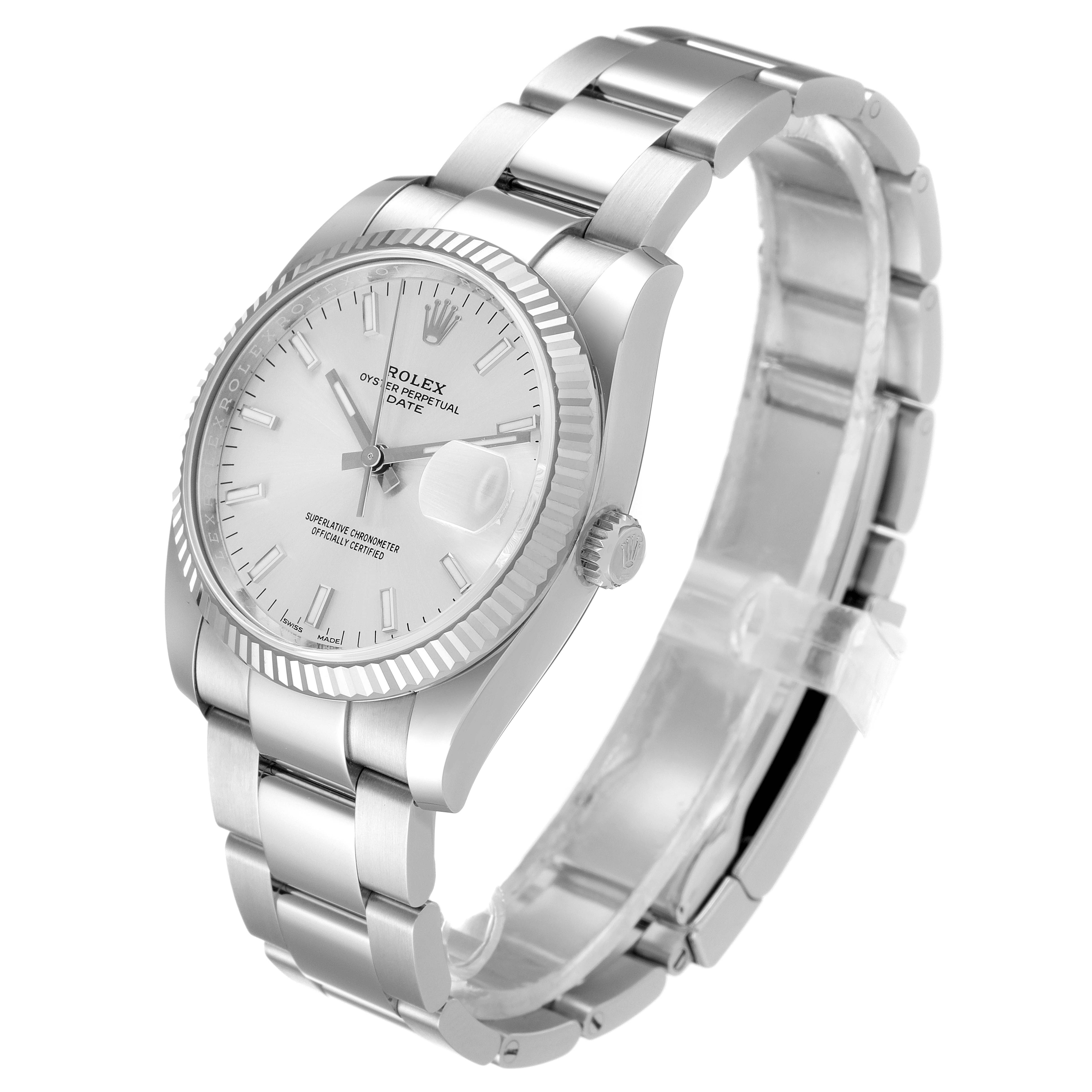 This image shows a Rolex Date 115234 Men's Stainless Steel Silver Dial 115234 Men's Stainless Steel Silver Dial model watch from an angled side view, highlighting the dial, bezel, crown, and bracelet.