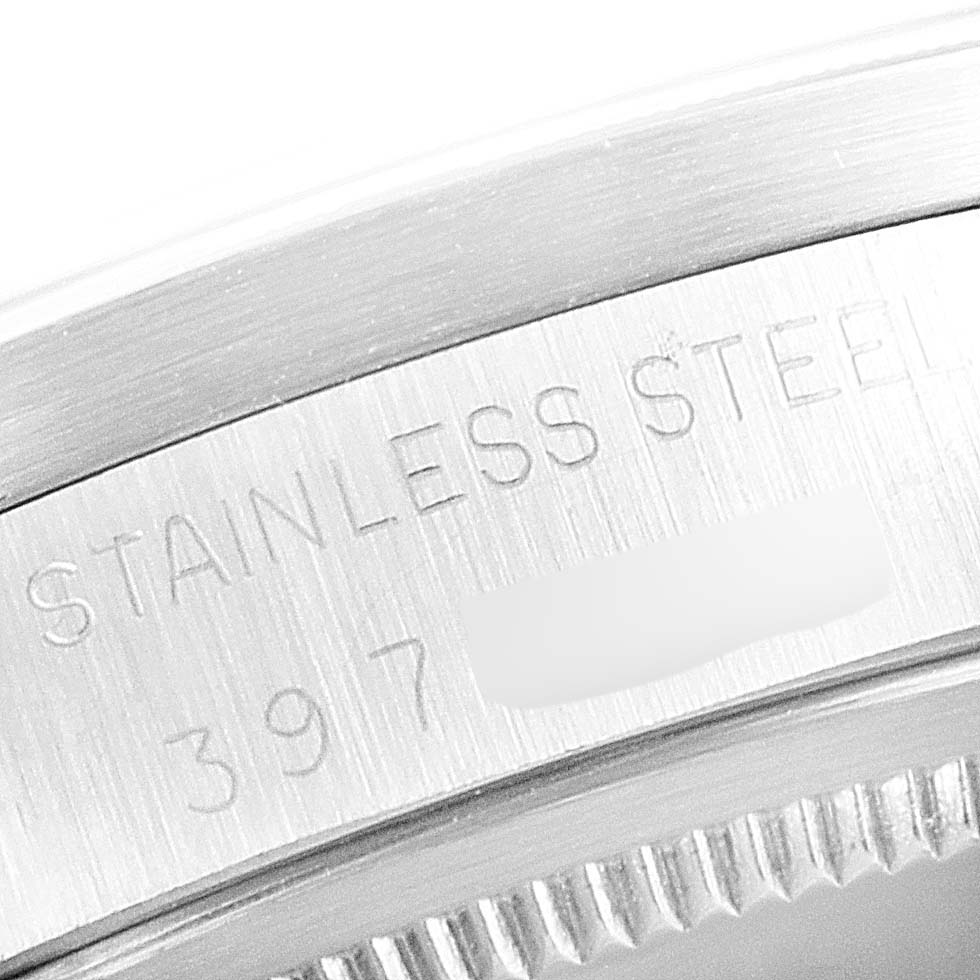 This detailed close-up image shows the side engraving of the Vintage Collection model by Rolex, highlighting "Stainless Steel" and partial serial number.