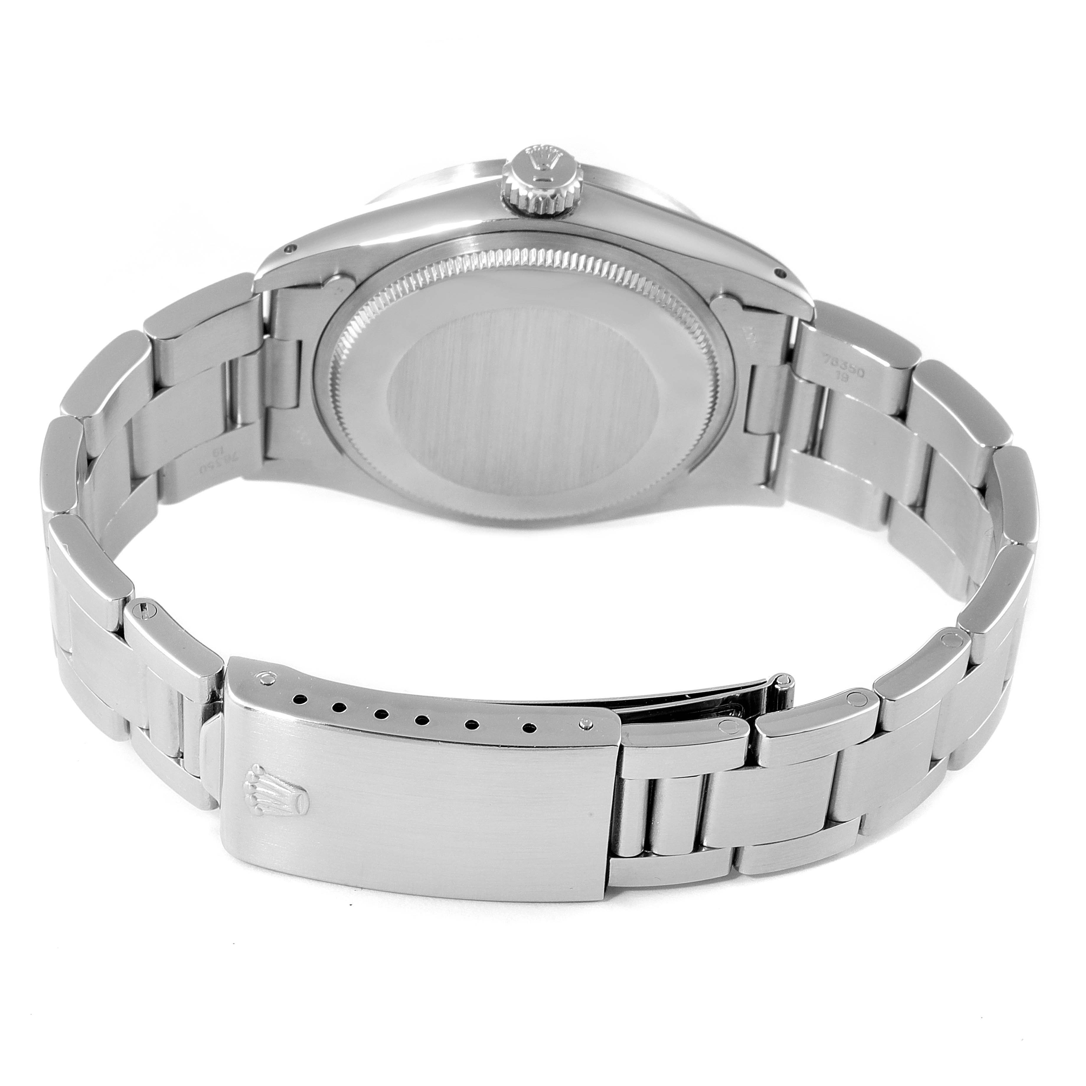 The image shows the back view of a Rolex Vintage Collection 1501 Men
s Stainless Steel Black Dial 1501 Men
s Stainless Steel Black Dial watch, focusing on the case back and the bracelet with a clasp.