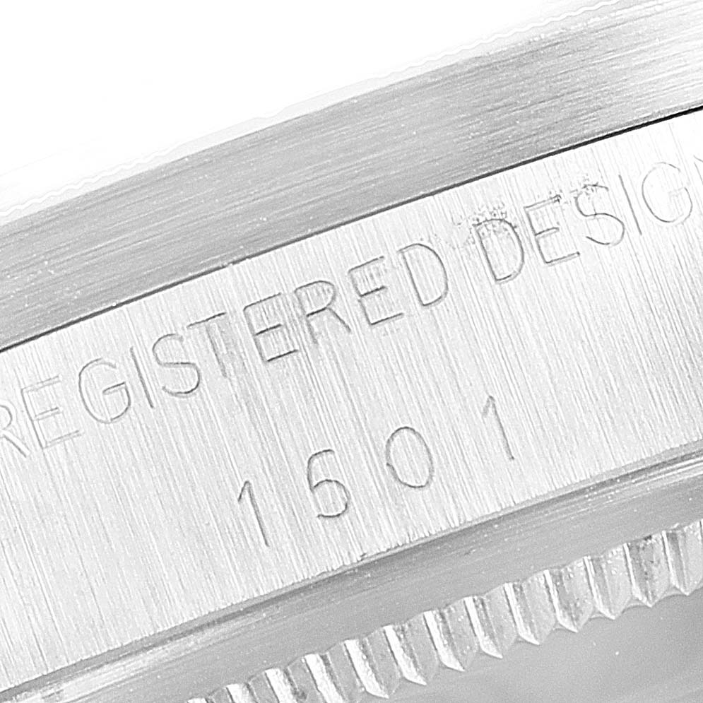 This image shows a close-up angle of the Rolex Vintage Collection 1501 Men
s Stainless Steel Black Dial 1501 Men
s Stainless Steel Black Dial model, highlighting its edge and serial number.