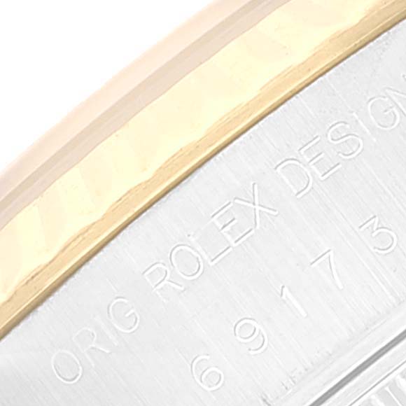 This close-up image shows the engraved bezel and model details of the Rolex Datejust 69173 Women's Steel and Gold (two tone) Blue Dial 69173 Women's Steel and Gold (two tone) Blue Dial watch.