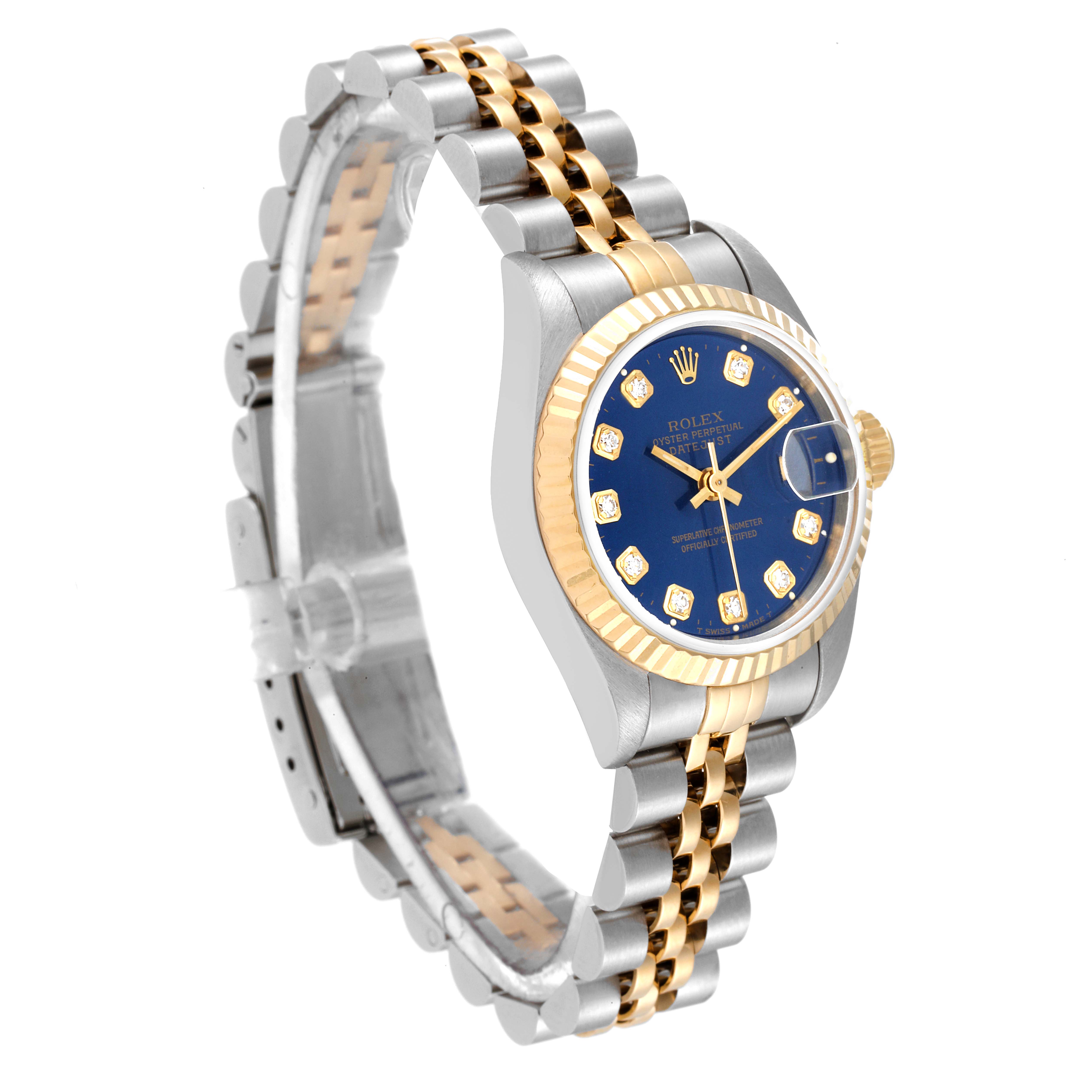 The image shows a Rolex Datejust 69173 Women's Steel and Gold (two tone) Blue Dial 69173 Women's Steel and Gold (two tone) Blue Dial watch at a three-quarter angle, highlighting its blue dial, gold bezel, and two-tone bracelet.