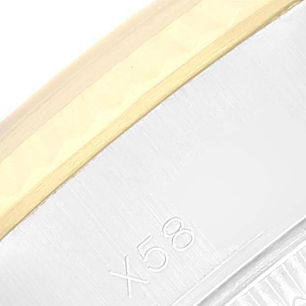 This close-up image shows part of the bezel and case of the Rolex Datejust 69173 Women's Steel and Gold (two tone) Champagne Dial 69173 Women's Steel and Gold (two tone) Champagne Dial watch.