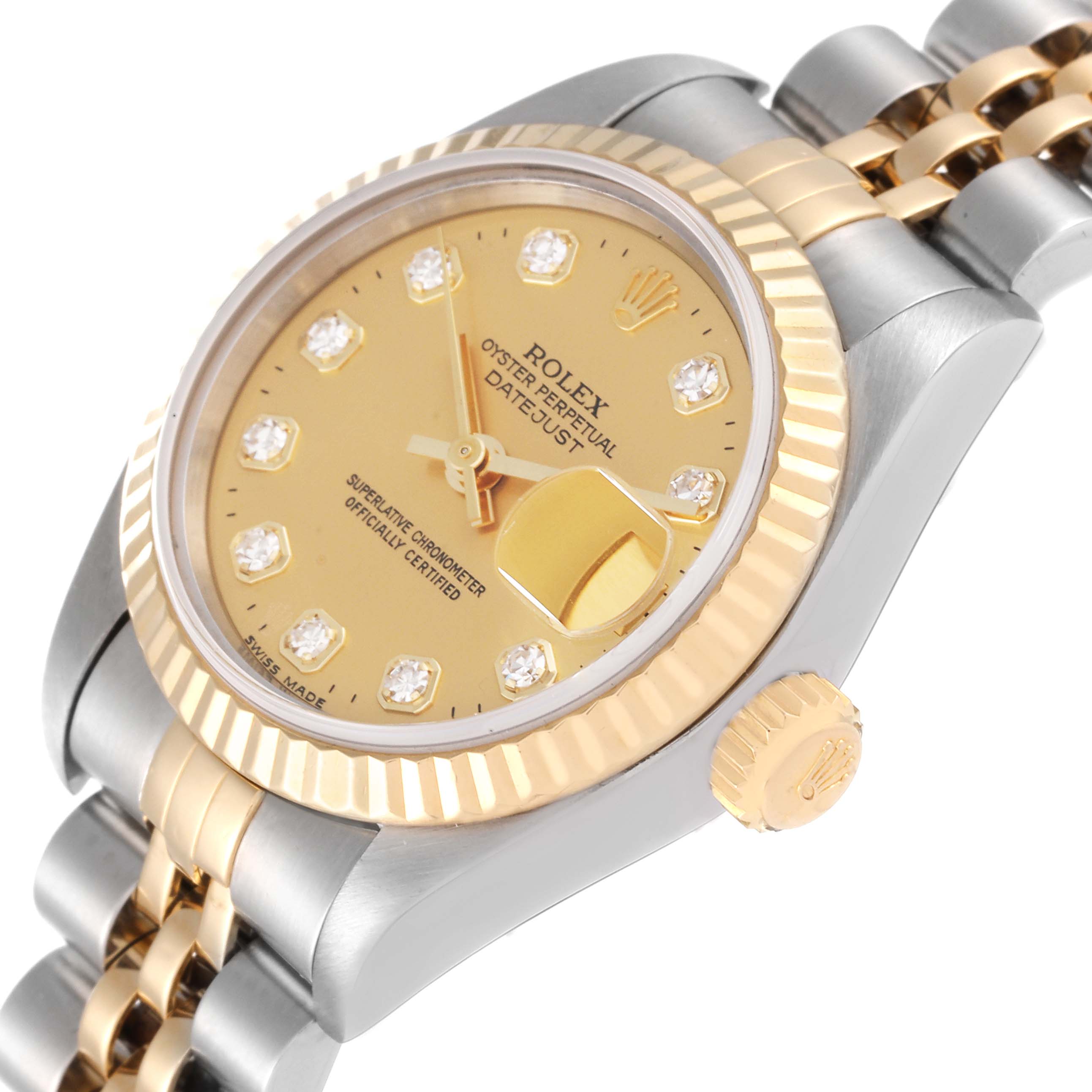 This Rolex Datejust 69173 Women's Steel and Gold (two tone) Champagne Dial 69173 Women's Steel and Gold (two tone) Champagne Dial watch is shown at a three-quarter angle, highlighting the gold dial, fluted bezel, and two-tone bracelet.