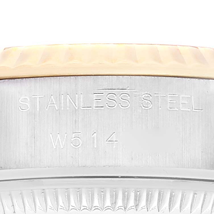 This image shows the side view of the stainless steel part of a Rolex Datejust 69173 Women's Steel and Gold (two tone) Champagne Dial 69173 Women's Steel and Gold (two tone) Champagne Dial watch with engraved details.