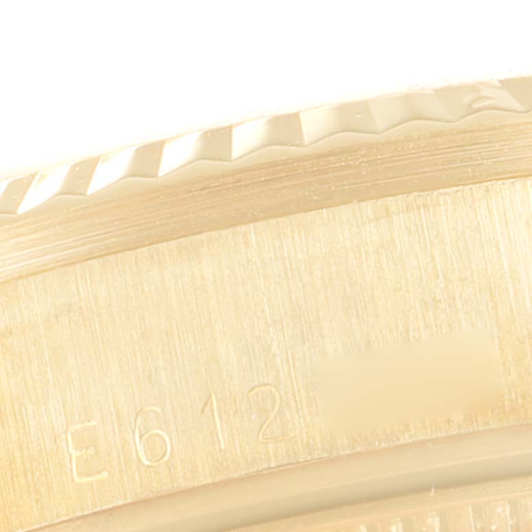 The image shows a close-up of the side of the bezel and the engraving on the case of a Rolex President 68278 Women's Yellow Gold Champagne Dial 68278 Women's Yellow Gold Champagne Dial model watch.