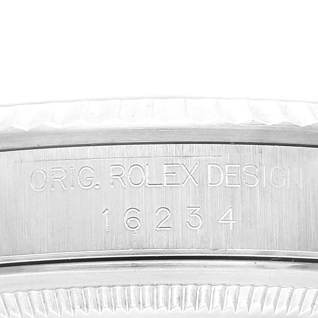 This image shows a close-up of the side engraving on the bezel and case of the Rolex Datejust 16234 Men's Stainless Steel Blue Dial 16234 Men's Stainless Steel Blue Dial watch, displaying the model number 16234.