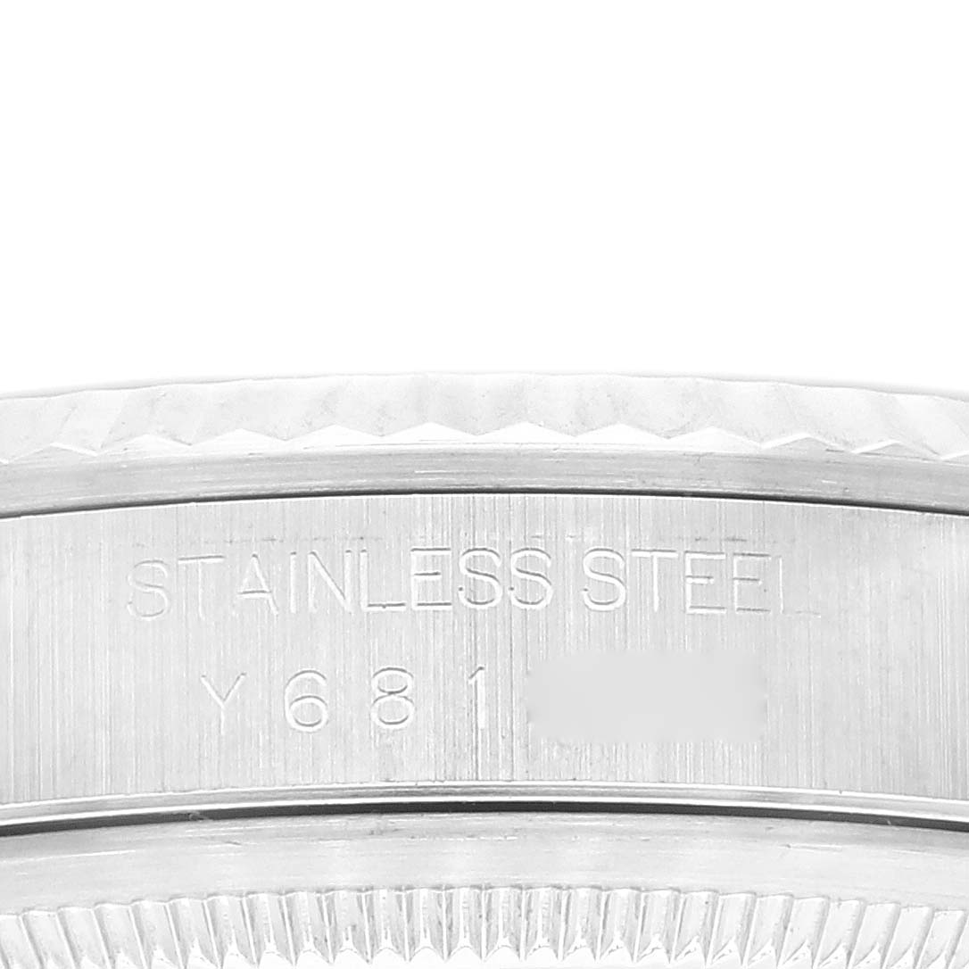 This image shows the side profile of a Rolex Datejust 16234 Men's Stainless Steel Blue Dial 16234 Men's Stainless Steel Blue Dial watch, focusing on the case details including the engraved text.