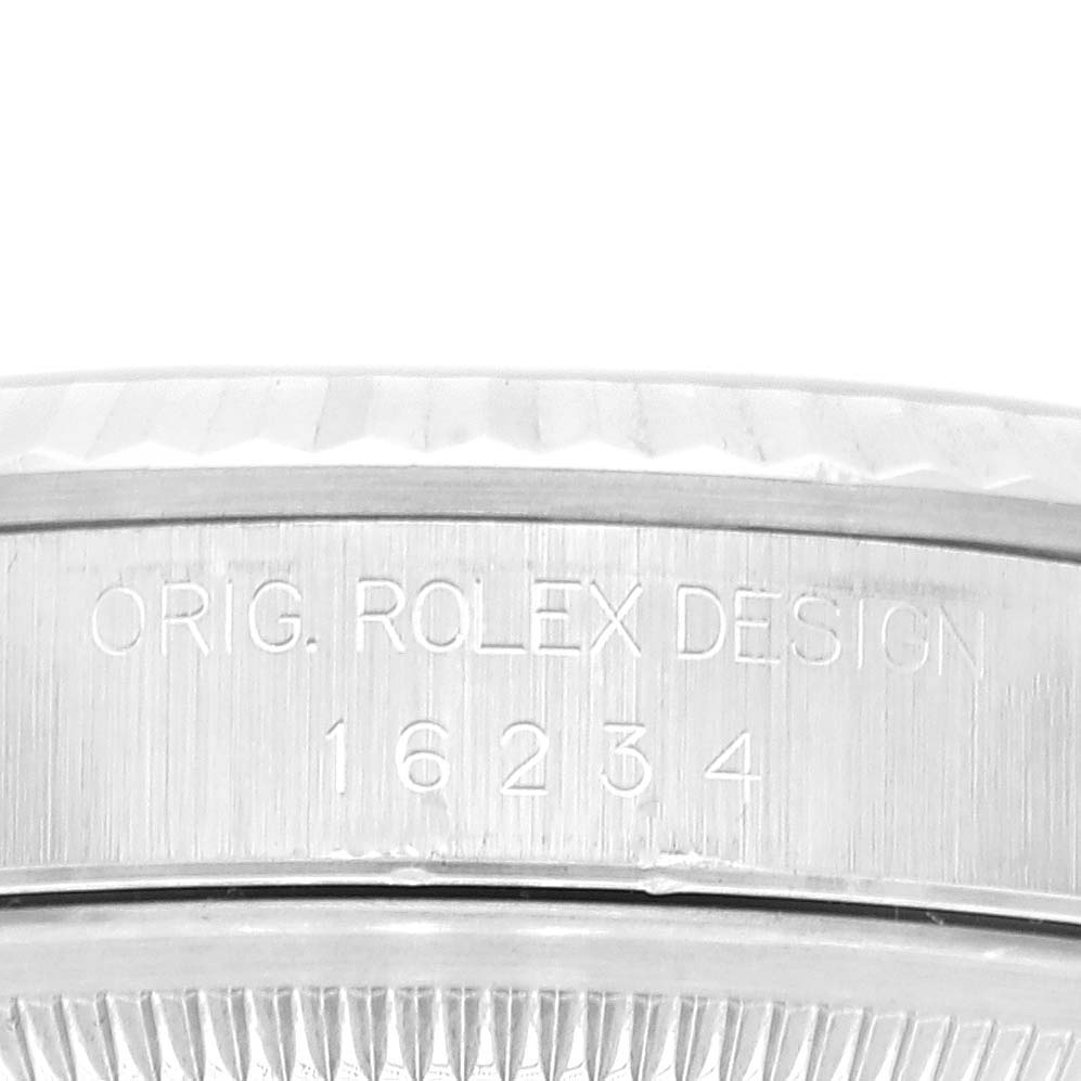 This image shows a close-up of the case side of the Rolex Datejust 16234 Men
s Stainless Steel Pink Dial 16234 Men
s Stainless Steel Pink Dial model, displaying the engraving "ORIG. ROLEX DESIGN" and model number 16234.