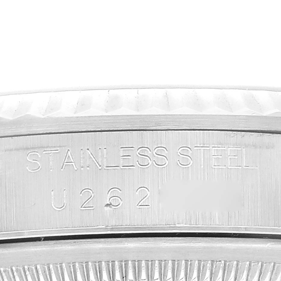 The image shows a close-up of the stainless steel case and serial number of a Rolex Datejust 16234 Men
s Stainless Steel Pink Dial 16234 Men
s Stainless Steel Pink Dial watch.