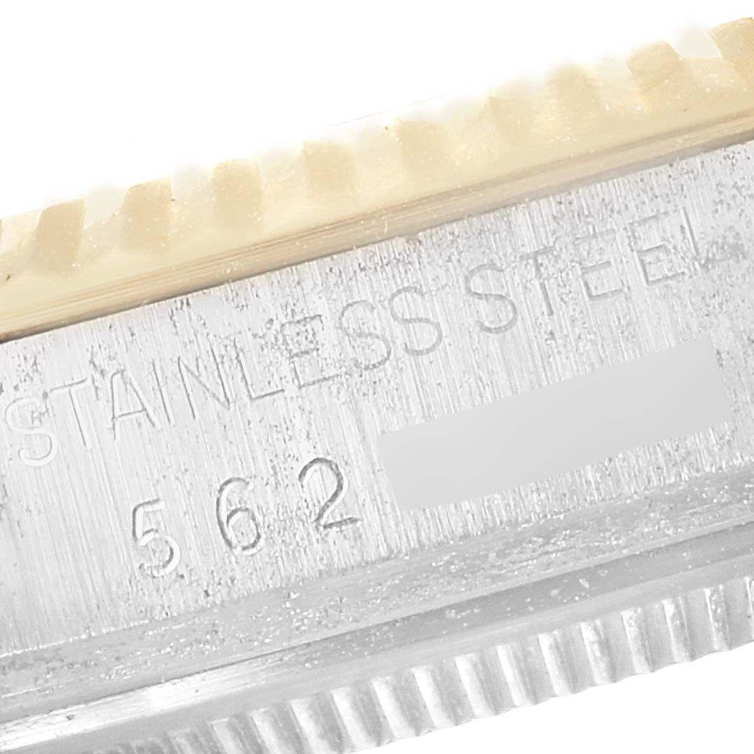 This close-up image shows the engraved stainless steel casing and part of the bezel of a Rolex Vintage Collection 16013 Men's Steel and Gold (two tone) Champagne Dial 16013 Men's Steel and Gold (two tone) Champagne Dial watch.