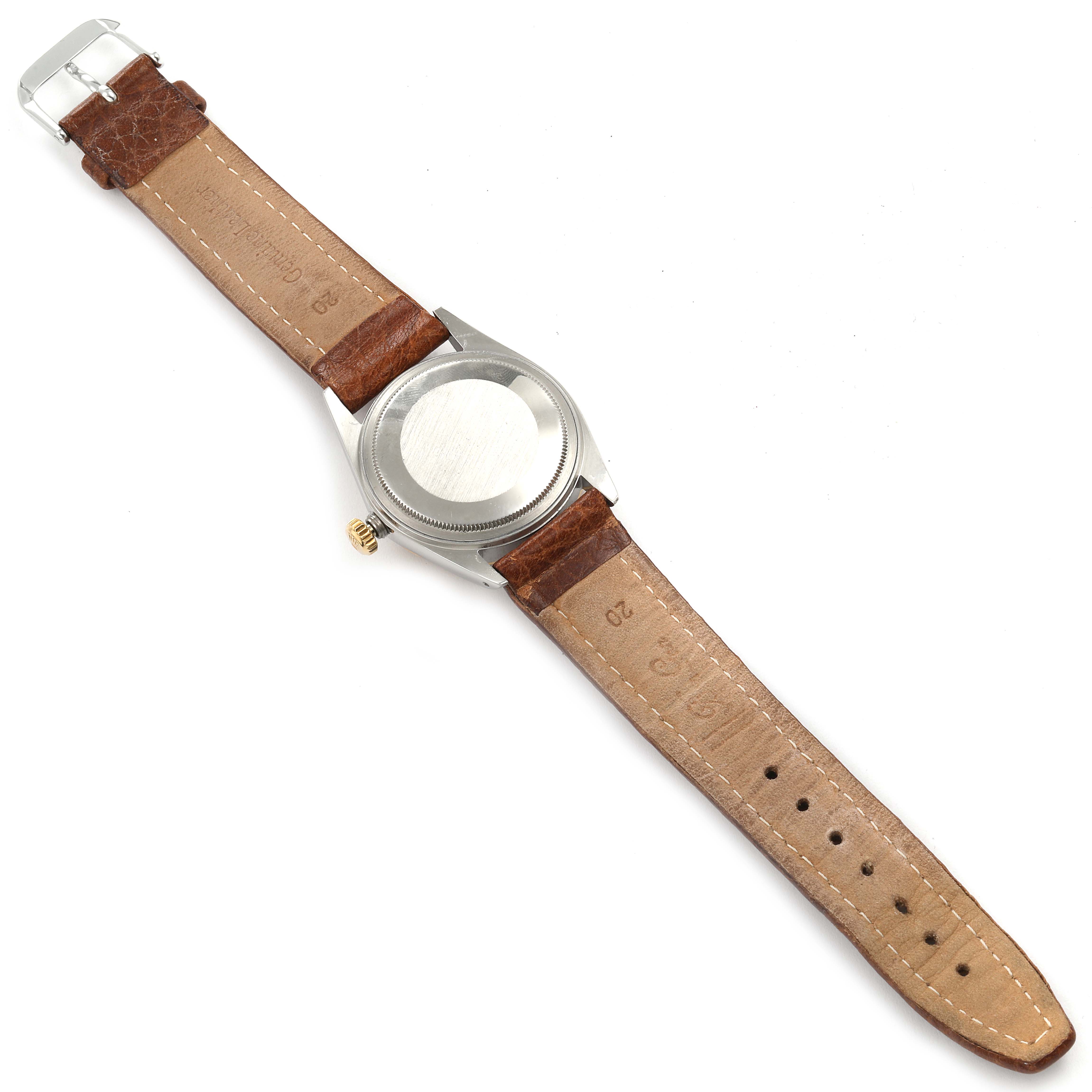 The image shows the back view and leather strap of a Vintage Collection Rolex watch in a flat position.