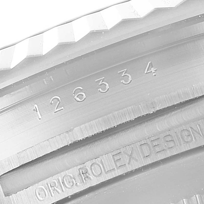This image shows a close-up of the serial number and design inscription on the bezel of a Rolex Datejust 41 126334 Men
s Stainless Steel Black Dial 126334 Men
s Stainless Steel Black Dial watch.