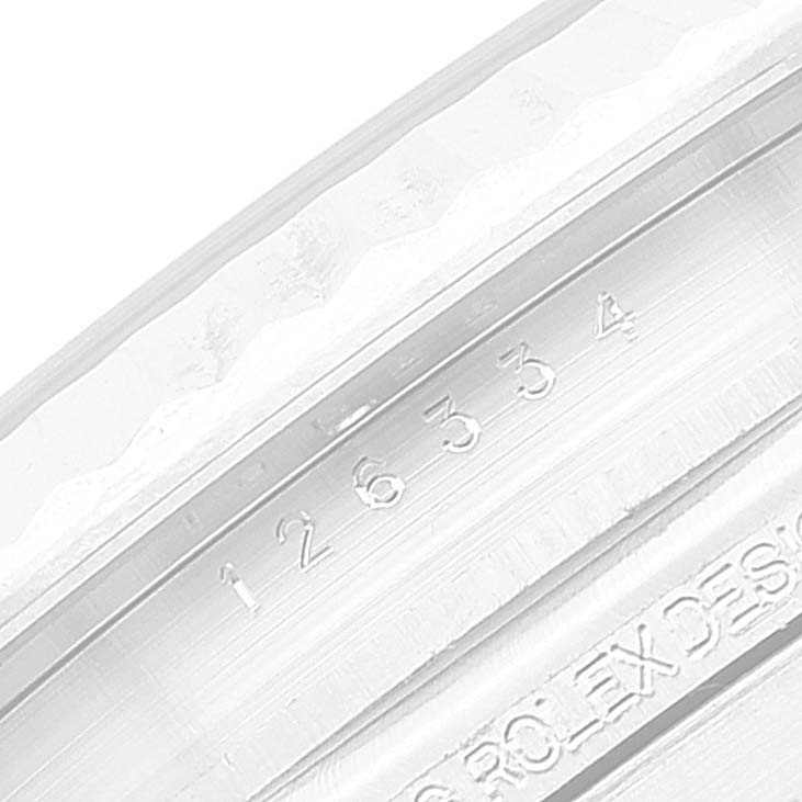 The image shows a close-up of the serial number engraved on the inner bezel of a Rolex Datejust 41 126334 Men's Stainless Steel Grey Dial 126334 Men's Stainless Steel Grey Dial watch.