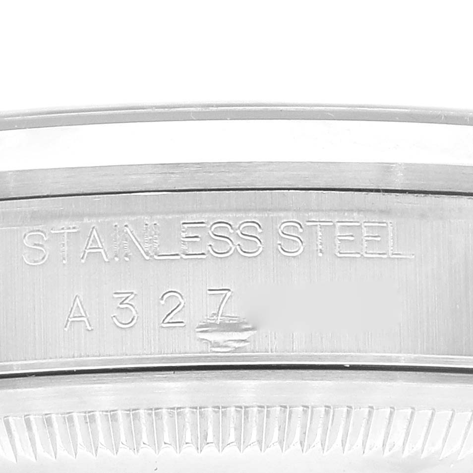 This is a close-up of the side of the case on a Rolex Datejust 16200 Men's Stainless Steel Blue Dial 16200 Men's Stainless Steel Blue Dial watch showing the "STAINLESS STEEL" engraving.