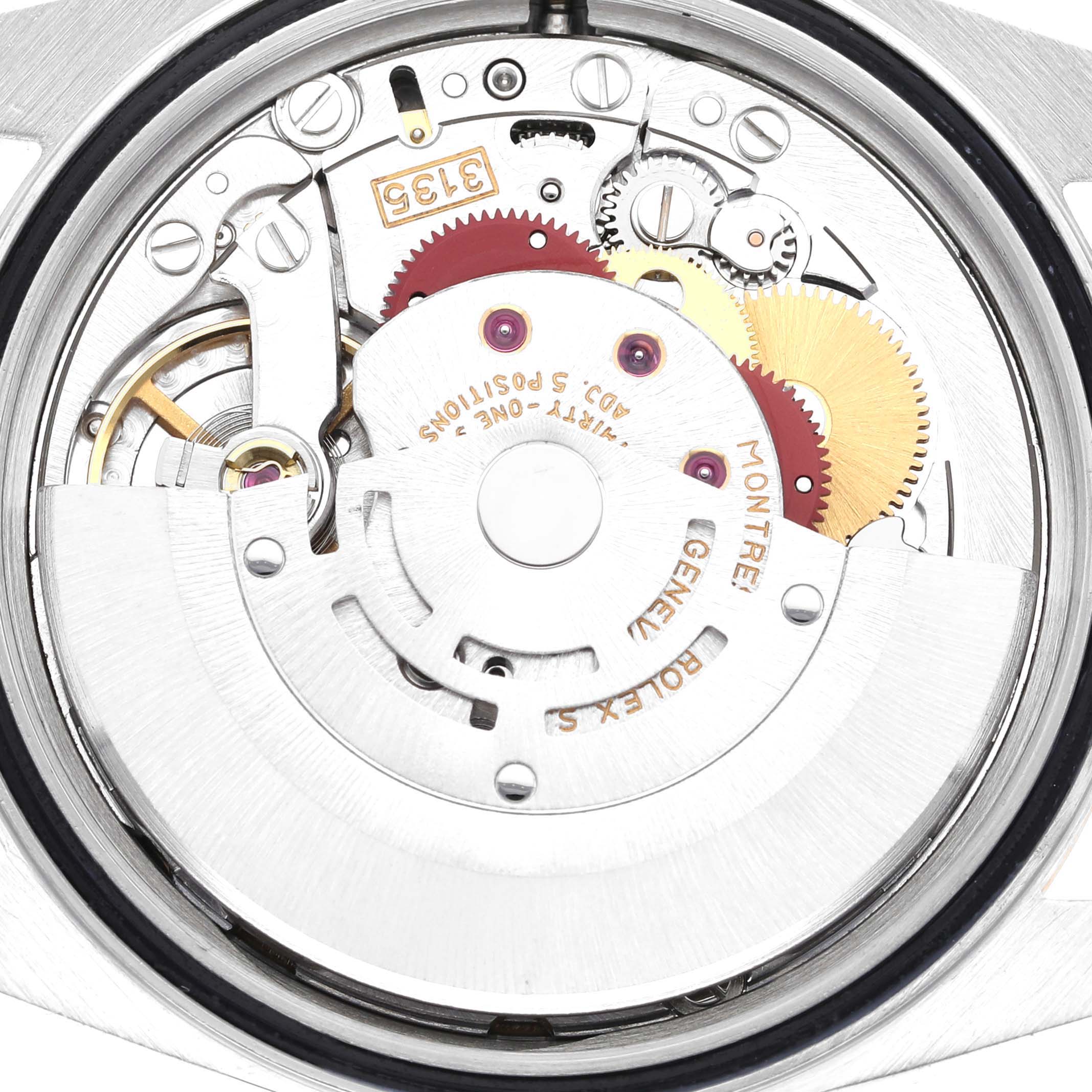 The image shows the internal mechanism of a Rolex Datejust 16233 Men's Steel and Gold (two tone) Champagne Dial 16233 Men's Steel and Gold (two tone) Champagne Dial watch, including gears, screws, and the oscillating weight.