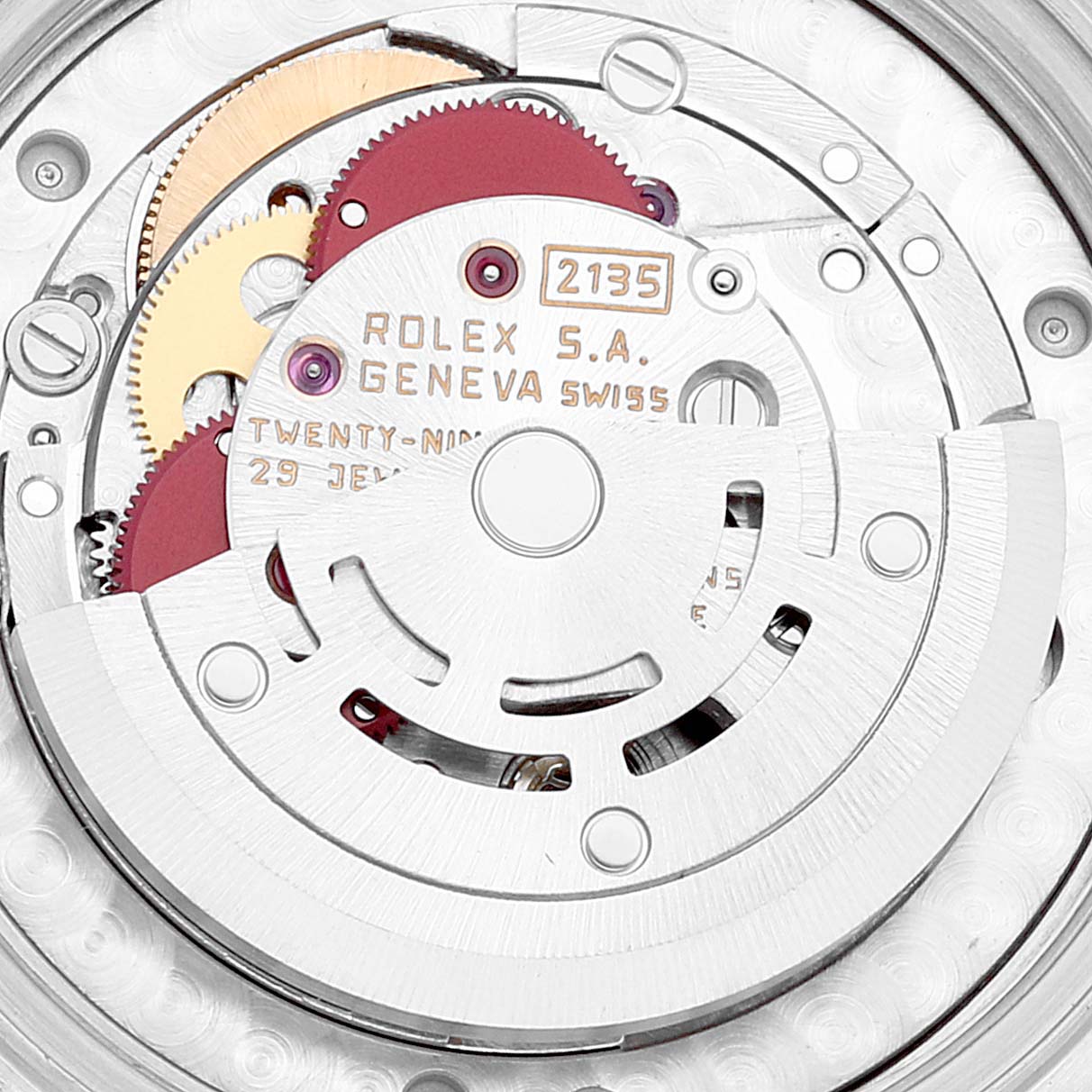The image shows a close-up of the movement and gears of a Mid-Size Rolex watch, highlighting the intricate internal mechanics.