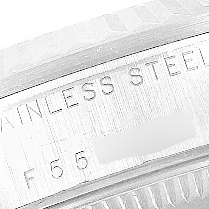The image shows a close-up of the stainless steel case back of a Rolex Mid-Size 78274 Women
s Stainless Steel Silver Dial 78274 Women
s Stainless Steel Silver Dial watch, highlighting engraved text.
