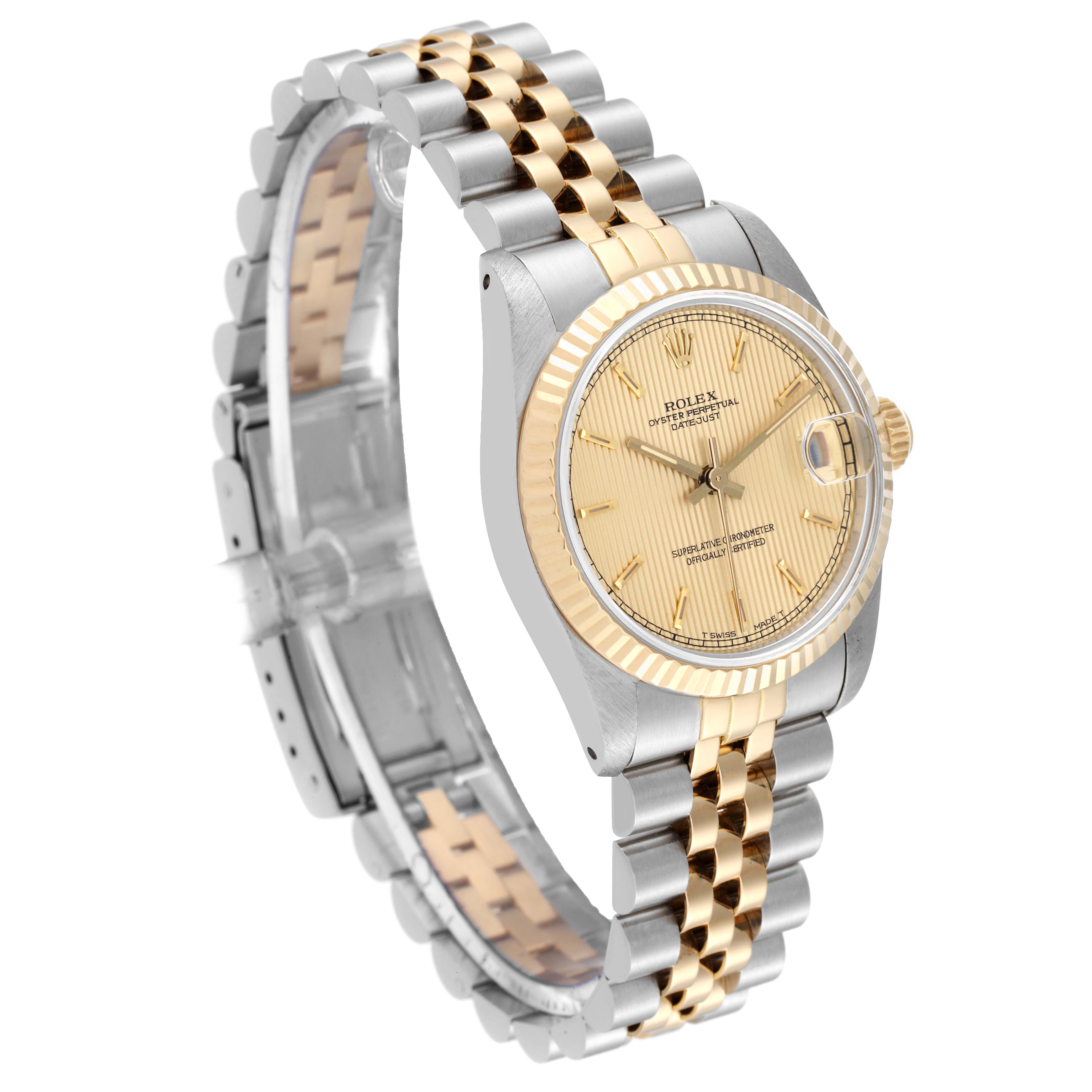 The image shows a Rolex Mid-Size 68273 Women's Steel and Gold (two tone) Champagne Dial 68273 Women's Steel and Gold (two tone) Champagne Dial model watch at an angle displaying the face, bezel, and two-tone metal bracelet.