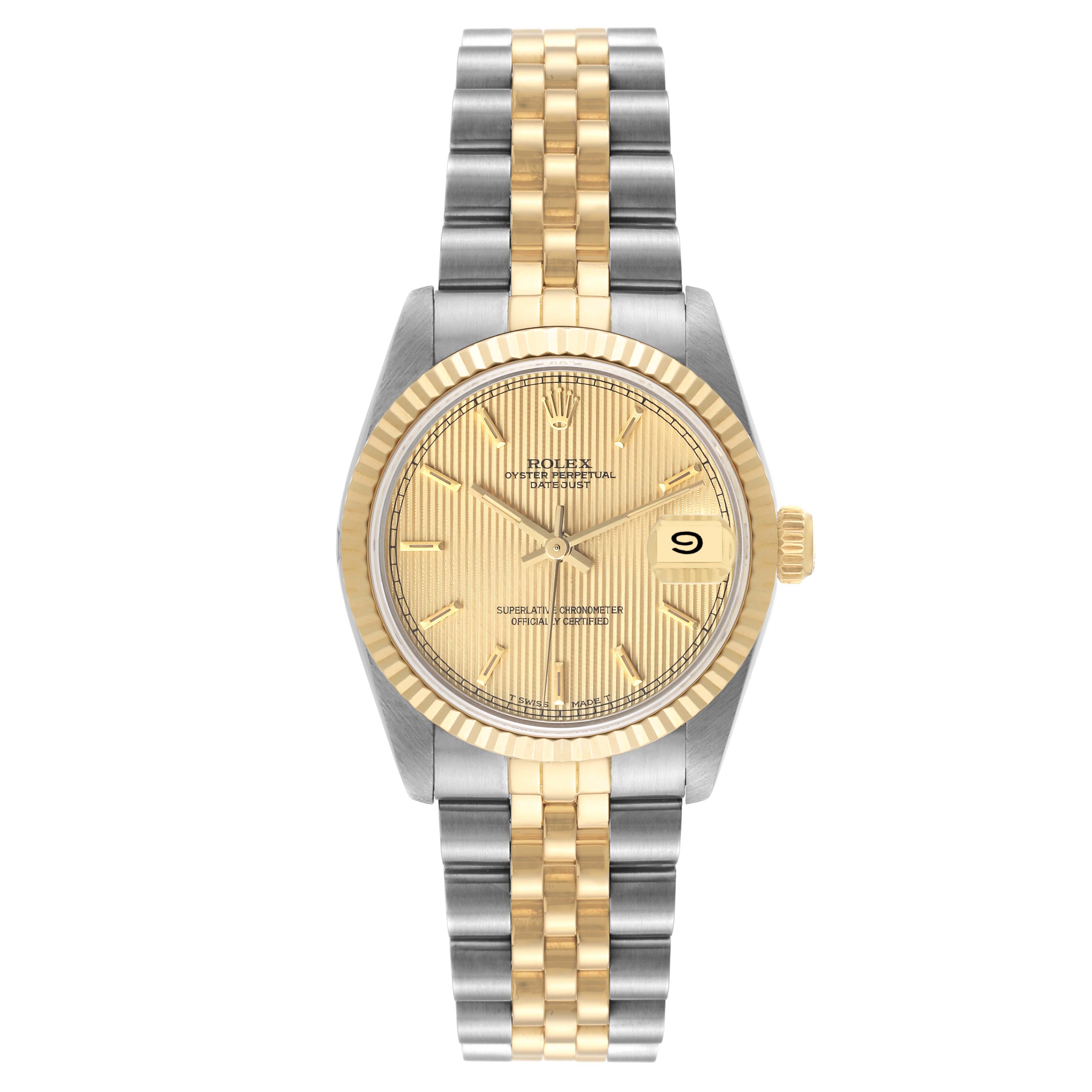 This image shows a front view of the Rolex Mid-Size 68273 Women's Steel and Gold (two tone) Champagne Dial 68273 Women's Steel and Gold (two tone) Champagne Dial watch, highlighting its two-tone bracelet, fluted bezel, and date display.