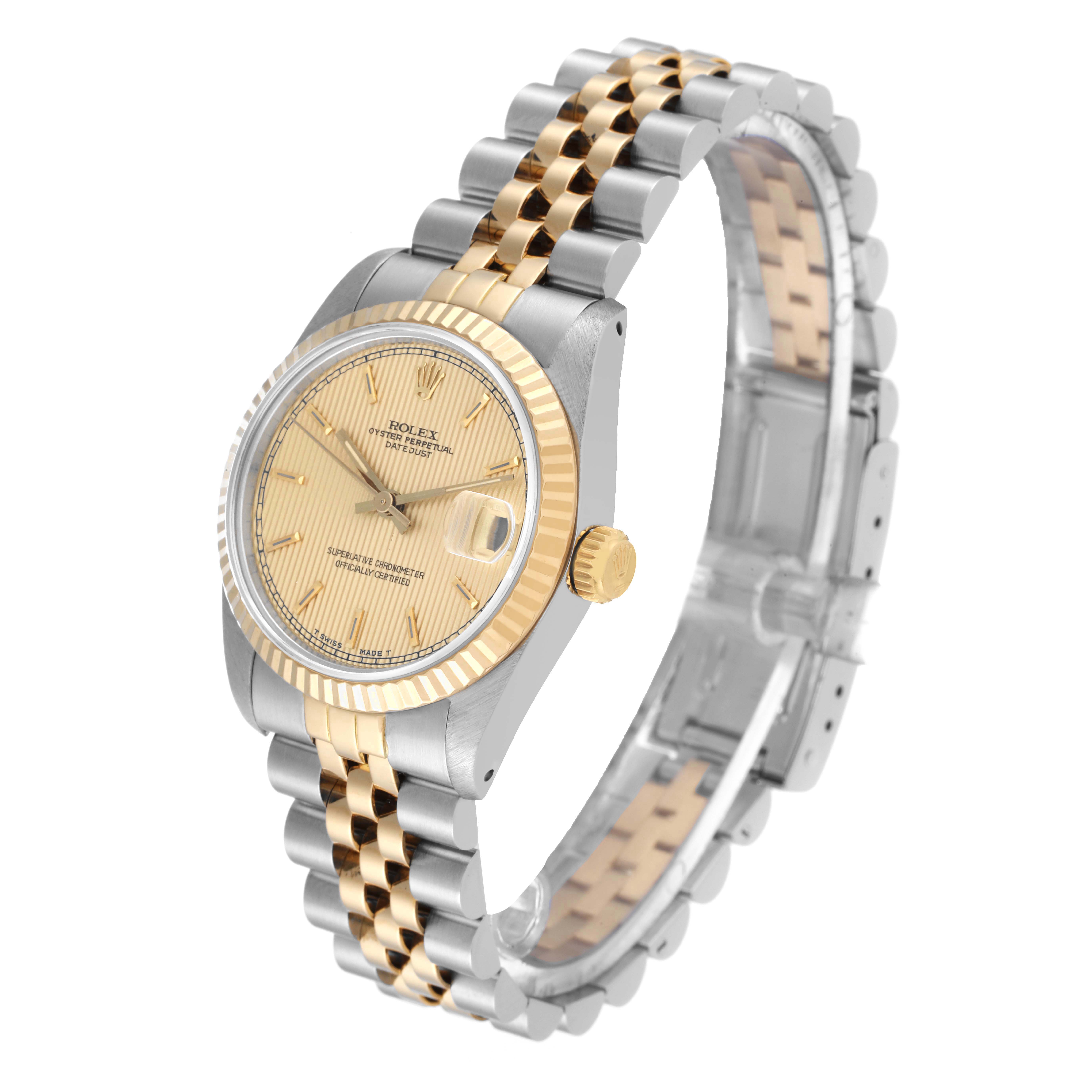 This image shows a side and slightly angled view of a Rolex Mid-Size 68273 Women's Steel and Gold (two tone) Champagne Dial 68273 Women's Steel and Gold (two tone) Champagne Dial model watch, displaying its dial, bezel, and bracelet.
