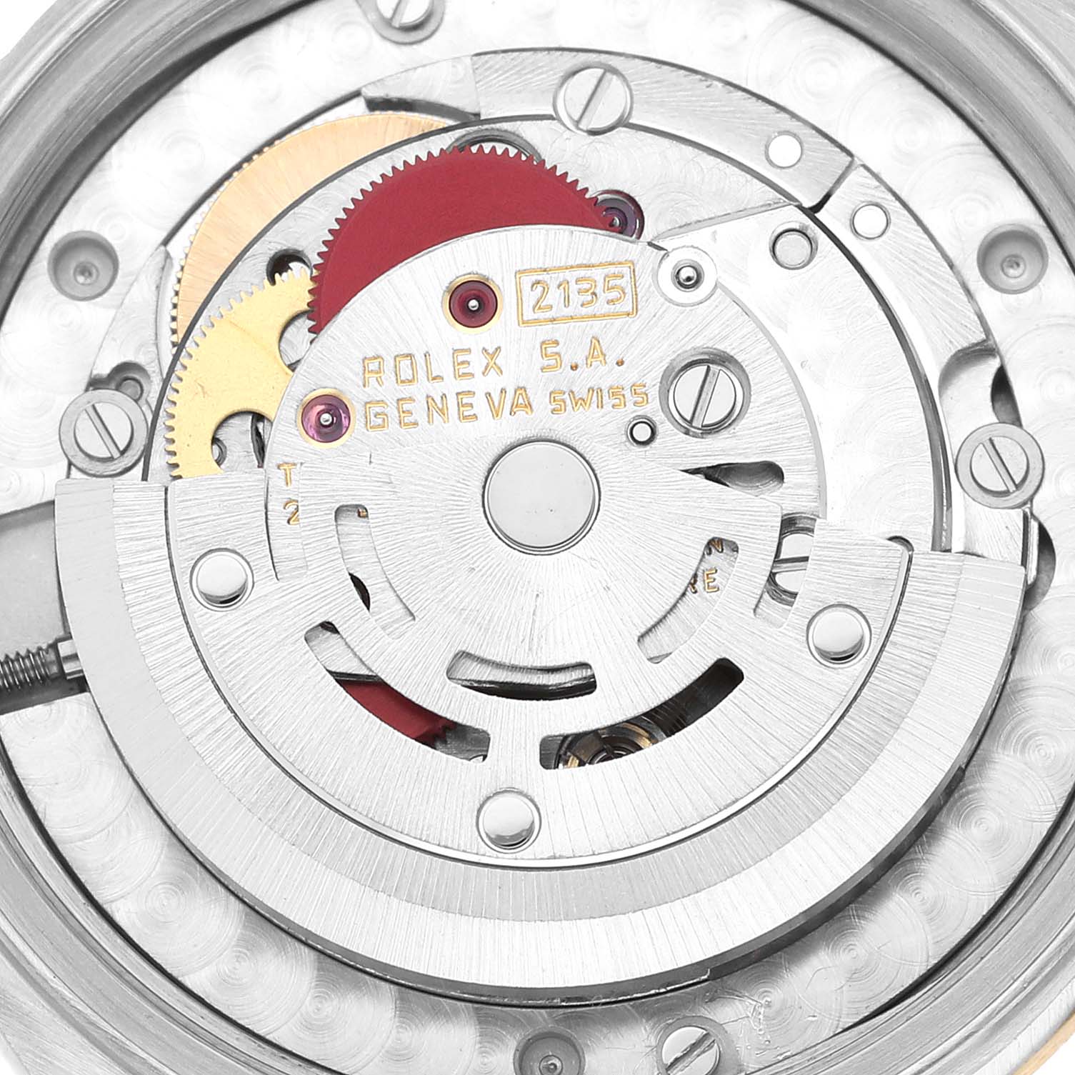 This image shows a close-up of the internal movement mechanism of a Mid-Size Rolex watch, model 2135, with visible gears and components.