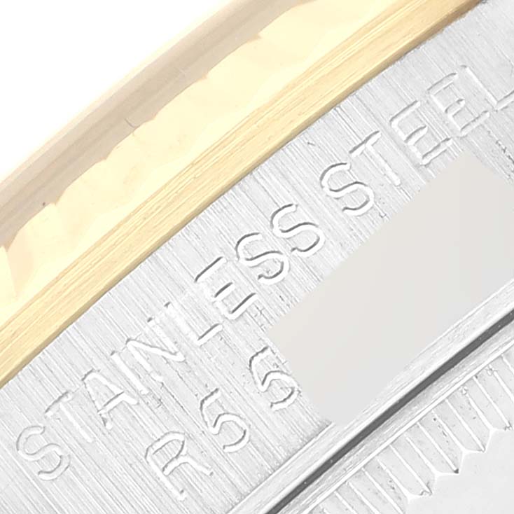 This close-up image of the Rolex Mid-Size 68273 Women's Steel and Gold (two tone) Champagne Dial 68273 Women's Steel and Gold (two tone) Champagne Dial model watch shows the engraving on the stainless steel case.