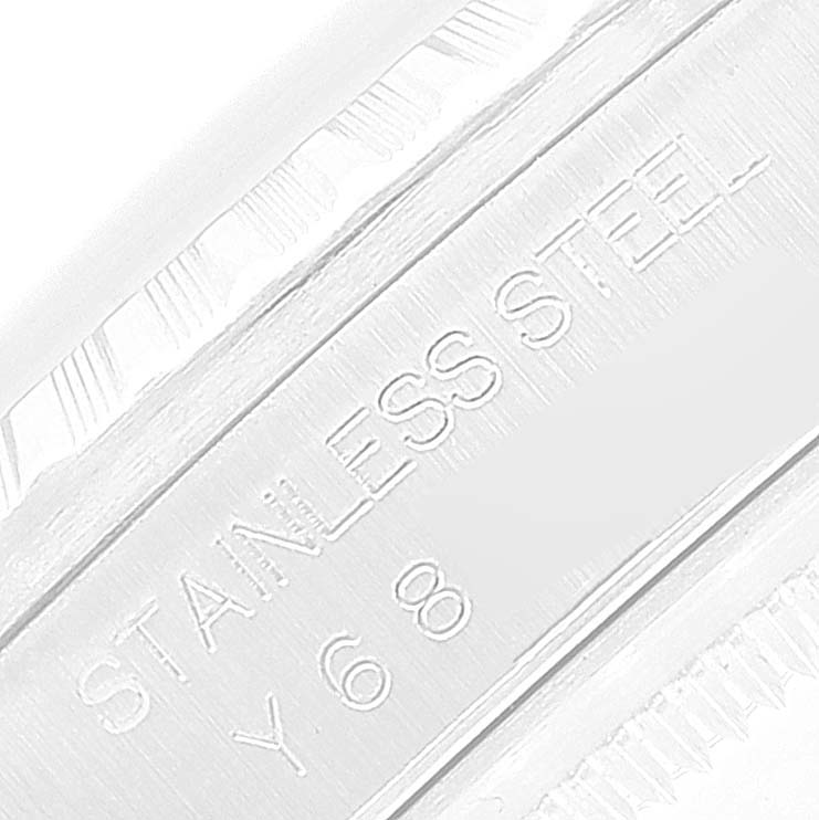 The image shows an angled close-up of the side of a Rolex Datejust 16220 Men's Stainless Steel Silver Dial 16220 Men's Stainless Steel Silver Dial, highlighting the "STAINLESS STEEL" engraving.