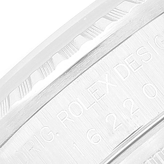 The image shows a close-up of the engraved case back and fluted bezel of a Rolex Datejust 16220 Men's Stainless Steel Silver Dial 16220 Men's Stainless Steel Silver Dial watch.