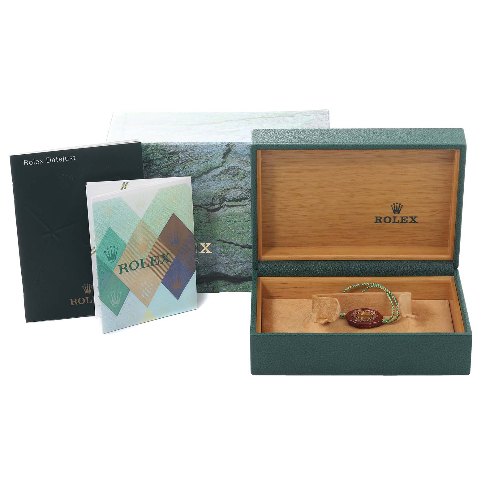 This image shows the open box of a Rolex Datejust 16220 Men's Stainless Steel Silver Dial 16220 Men's Stainless Steel Silver Dial watch alongside its accessories, including booklets and tags.