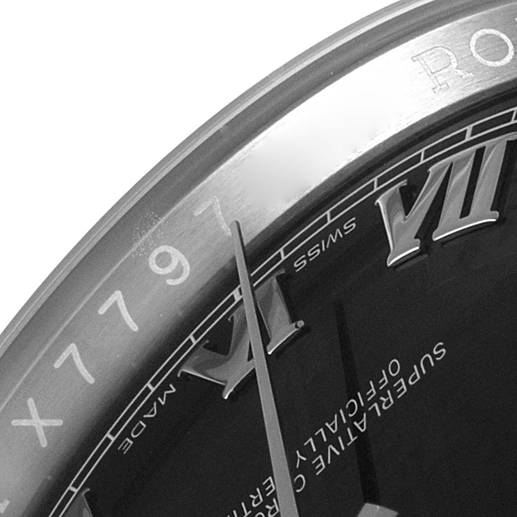 This image shows a close-up of the dial and part of the bezel from a Rolex Datejust 116234 Men's Stainless Steel Black Dial 116234 Men's Stainless Steel Black Dial watch.