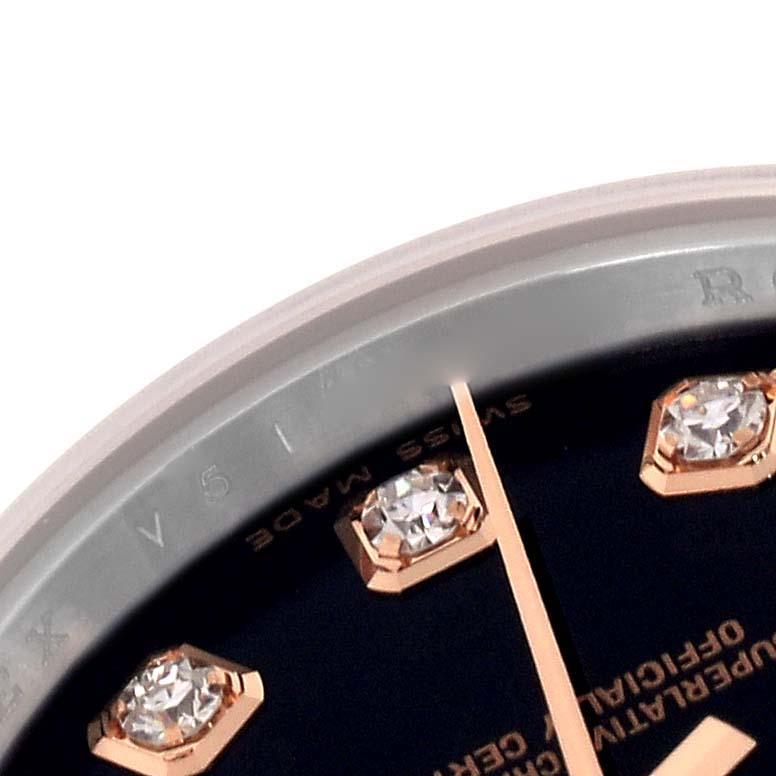 The image shows a close-up of the Rolex Datejust 179171 Women's Steel and Gold (two tone) Black Dial 179171 Women's Steel and Gold (two tone) Black Dial watch dial with diamond markers and hands.