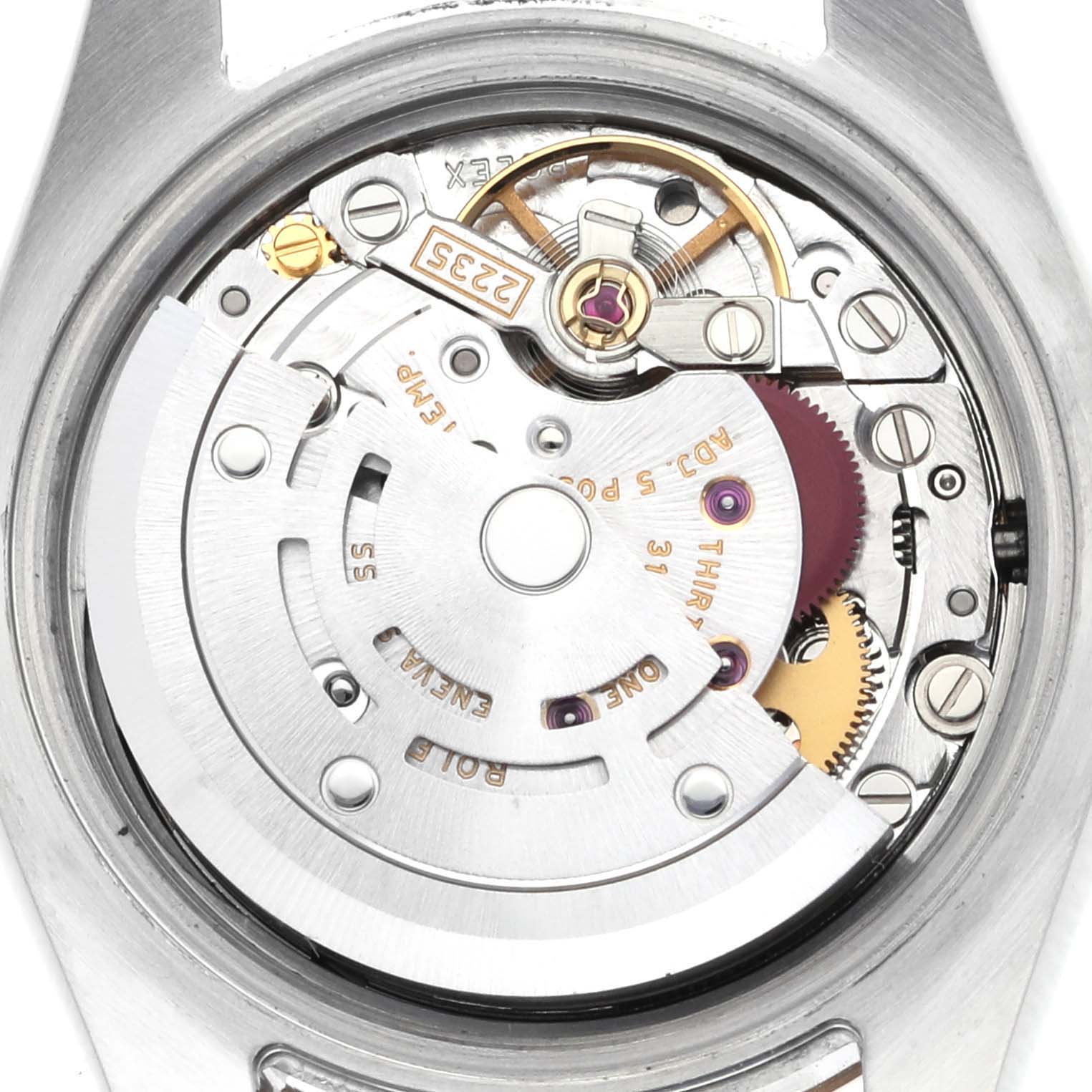 The image shows the Rolex Datejust 179171 Women's Steel and Gold (two tone) Black Dial 179171 Women's Steel and Gold (two tone) Black Dial's internal movement from the back, featuring gears and the rotor.