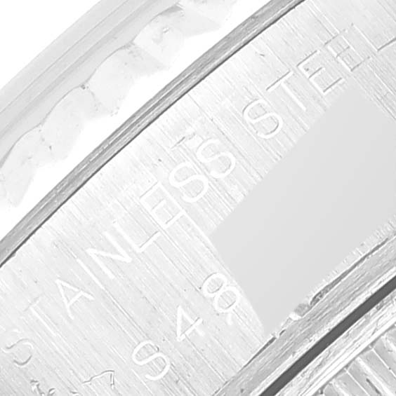 This close-up image shows the stainless steel engraving on the inner side of the bezel of a Rolex Datejust 69174 Women's Stainless Steel Black Dial 69174 Women's Stainless Steel Black Dial watch.
