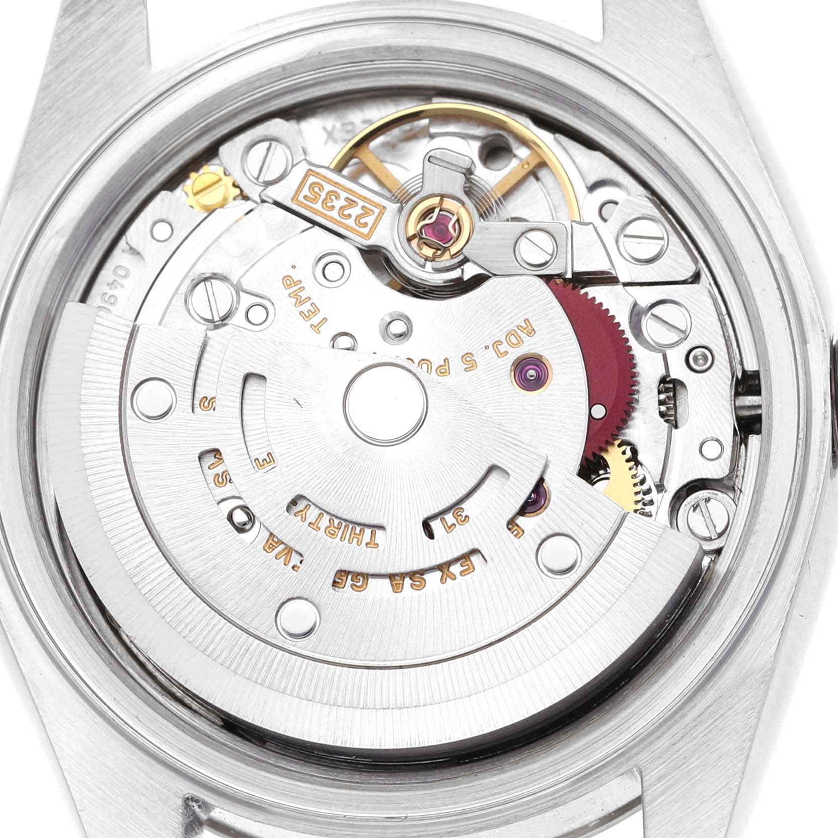 This is an inside view of a Rolex Datejust 79174 Women's Stainless Steel Silver Dial 79174 Women's Stainless Steel Silver Dial watch showing its intricate mechanical movement components.