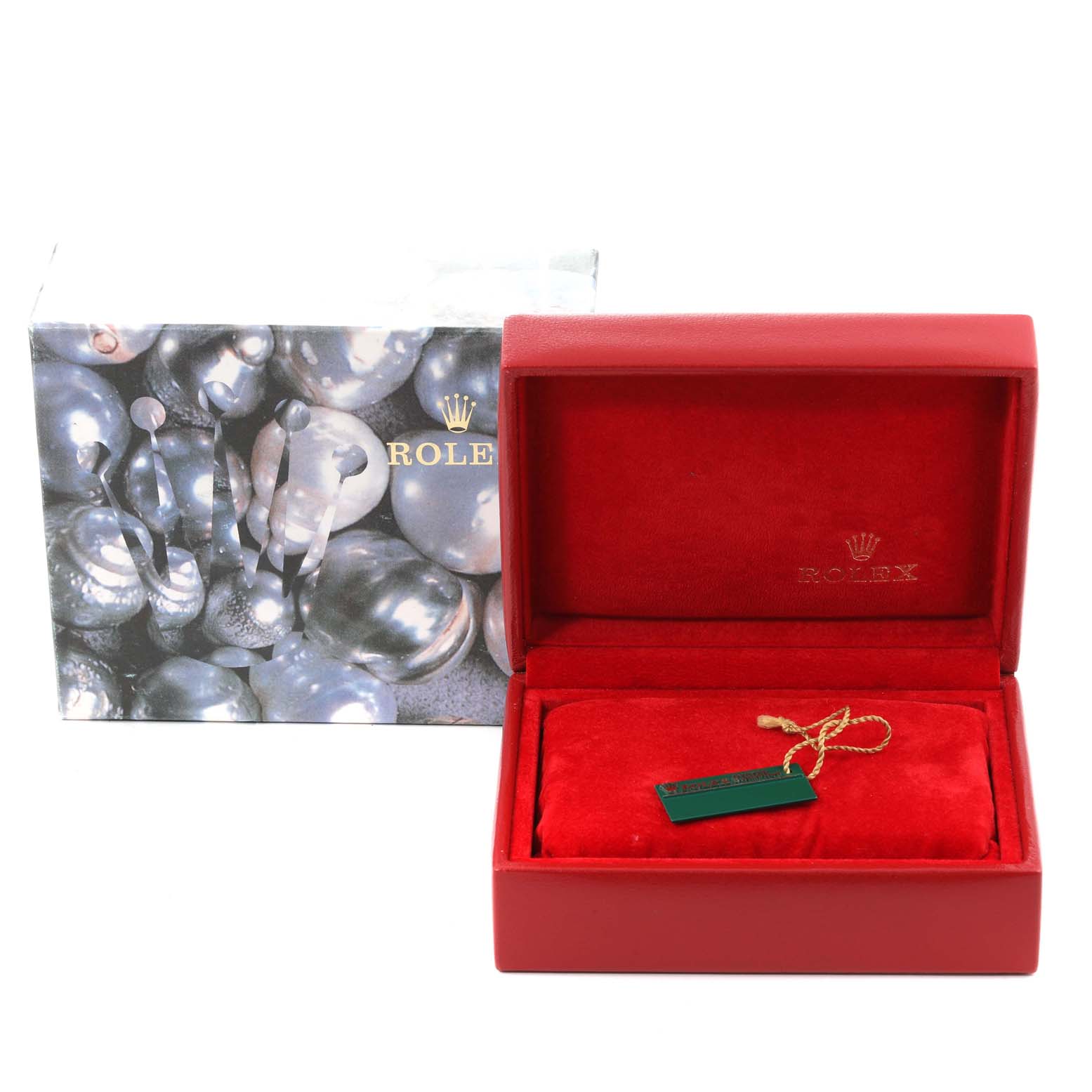 This image shows the packaging and a red interior display box for a Rolex Datejust 79174 Women's Stainless Steel Silver Dial 79174 Women's Stainless Steel Silver Dial watch, with a tag placed on the pillow inside.