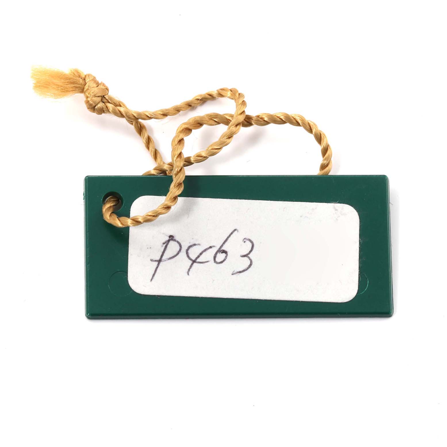 The image shows a green tag with a yellow string, likely an original accessory for the Rolex Datejust 79174 Women's Stainless Steel Silver Dial 79174 Women's Stainless Steel Silver Dial model watch.