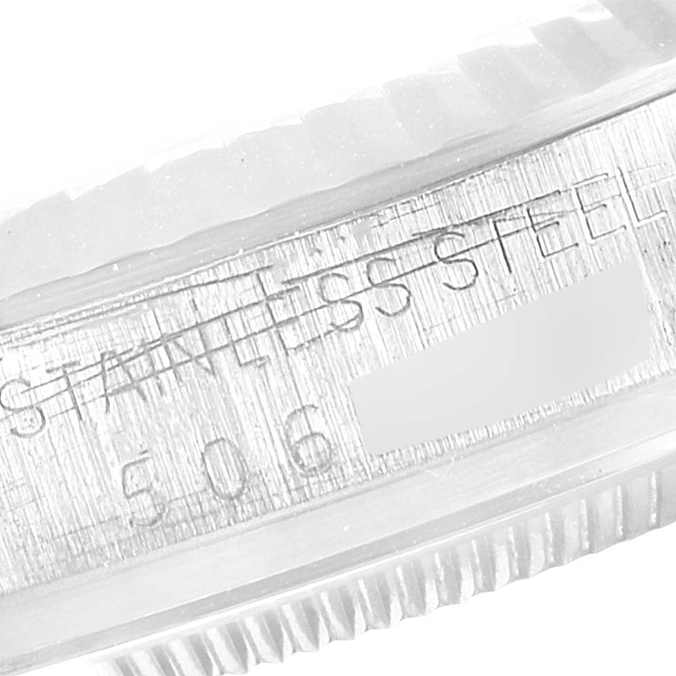 The image shows a close-up of the stainless steel case back and model number engraving of a Rolex Vintage Collection 1601 Men's Stainless Steel Silver Dial 1601 Men's Stainless Steel Silver Dial watch.