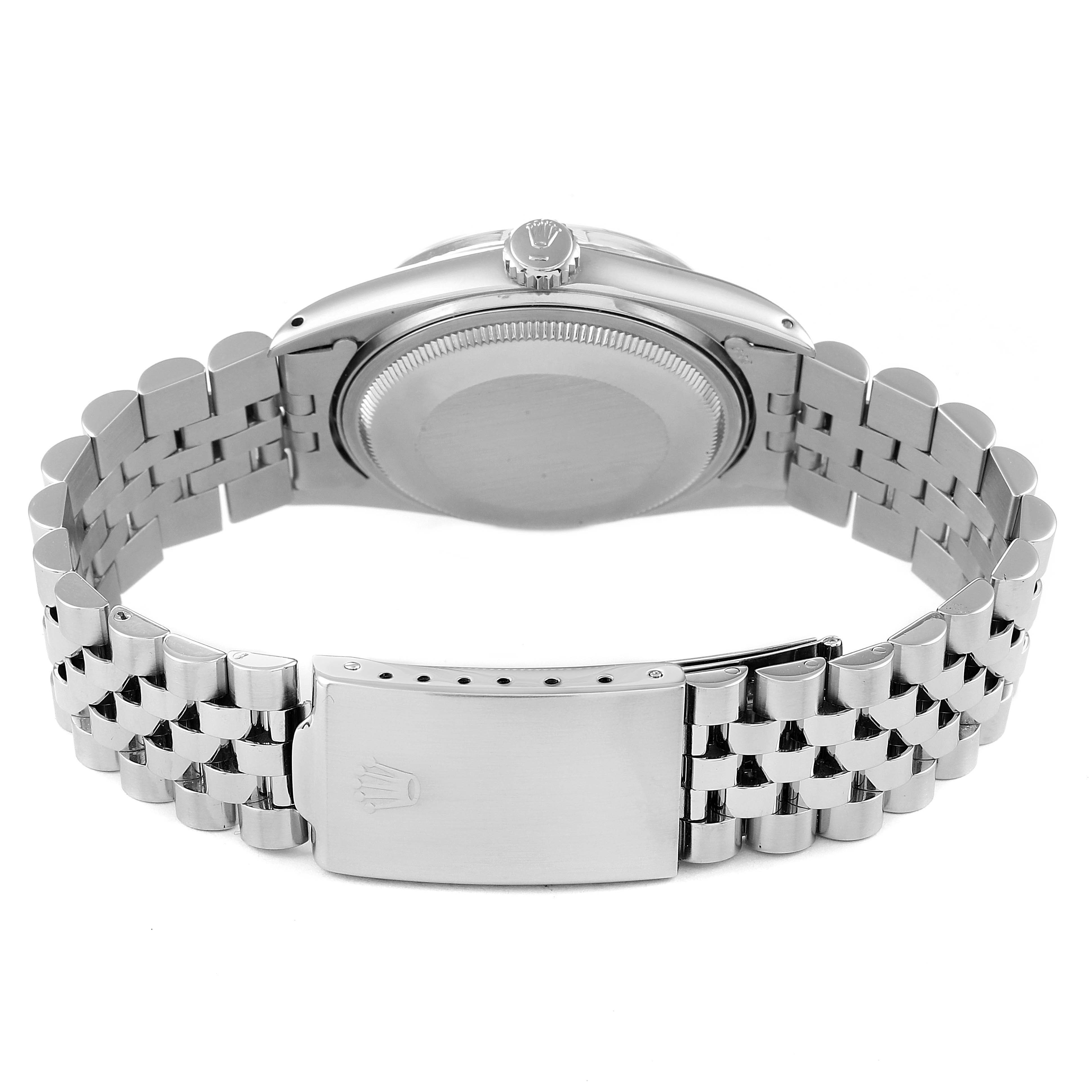 The image shows the back and bracelet of the Vintage Collection model by Rolex, highlighting the clasp and caseback.