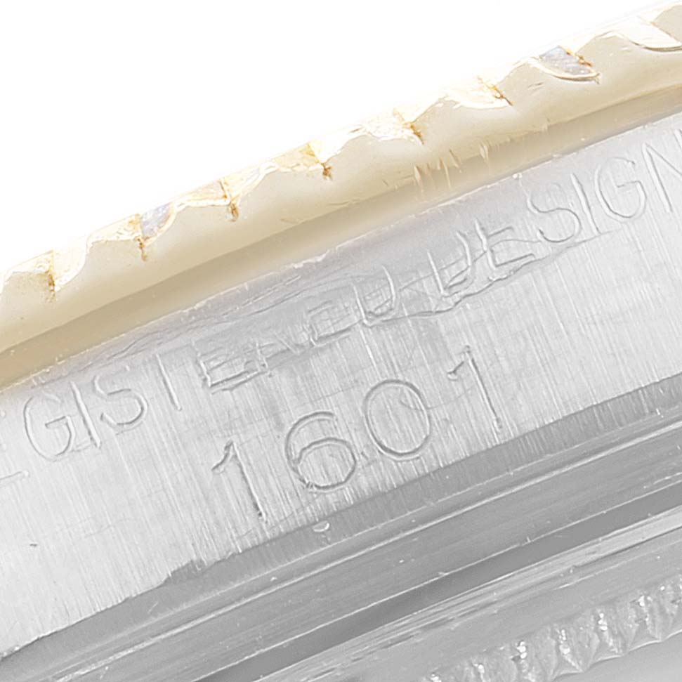 The image shows a close-up view of the engraved serial number on the side of the Rolex Vintage Collection 1601 Men's Steel and Gold (two tone) Blue Dial 1601 Men's Steel and Gold (two tone) Blue Dial model.