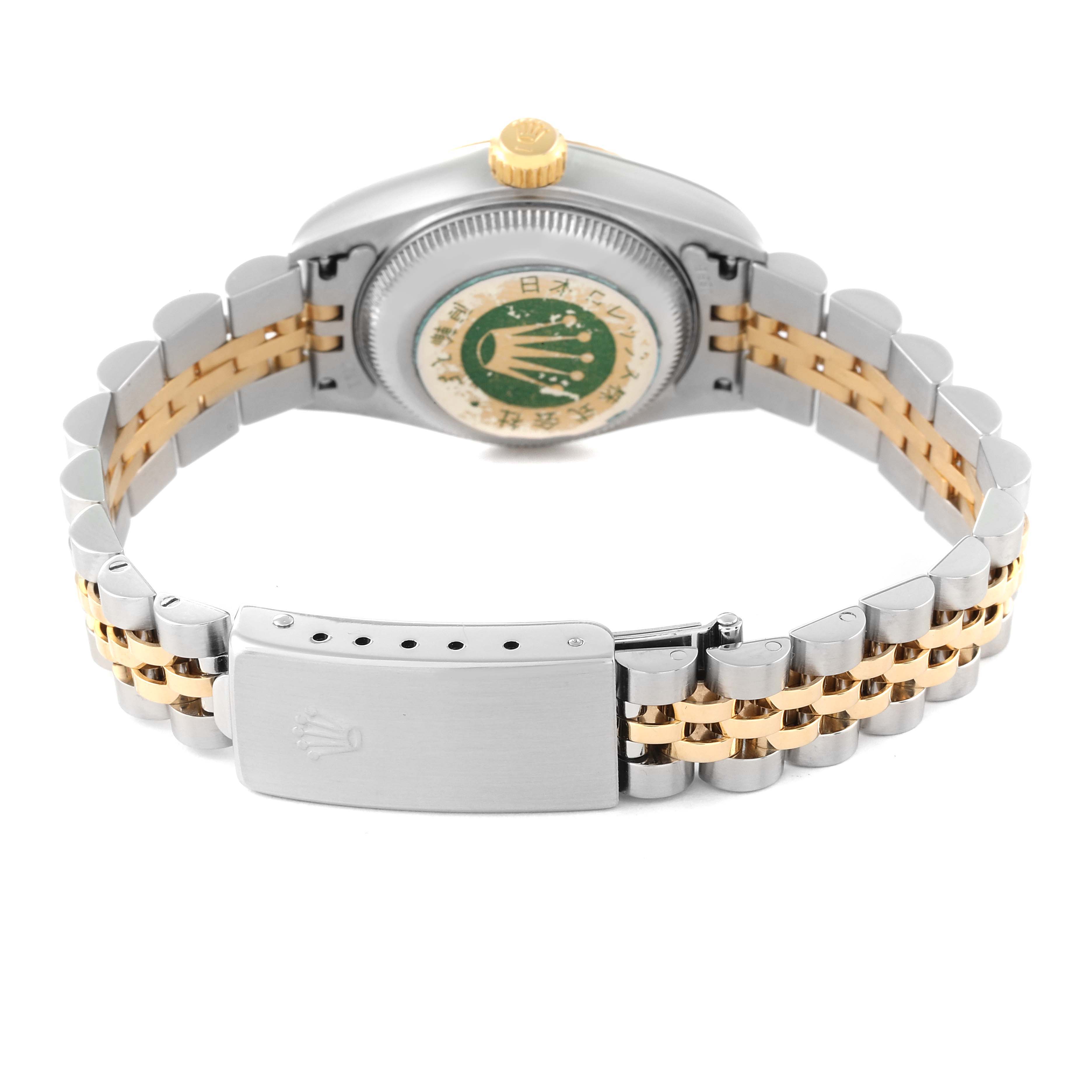 The image shows the back of a Rolex Datejust 79173 Women's Steel and Gold (two tone) Champagne Dial 79173 Women's Steel and Gold (two tone) Champagne Dial watch, highlighting the case back and a two-tone bracelet with the clasp.