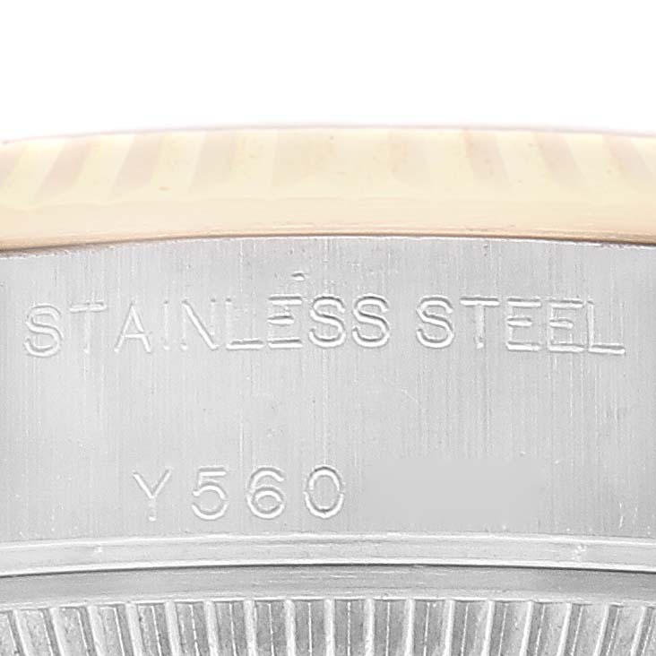 This image shows a close-up of the stainless steel casing back of a Rolex Datejust 79173 Women's Steel and Gold (two tone) Champagne Dial 79173 Women's Steel and Gold (two tone) Champagne Dial watch, displaying its brushed finish and model number, Y560.