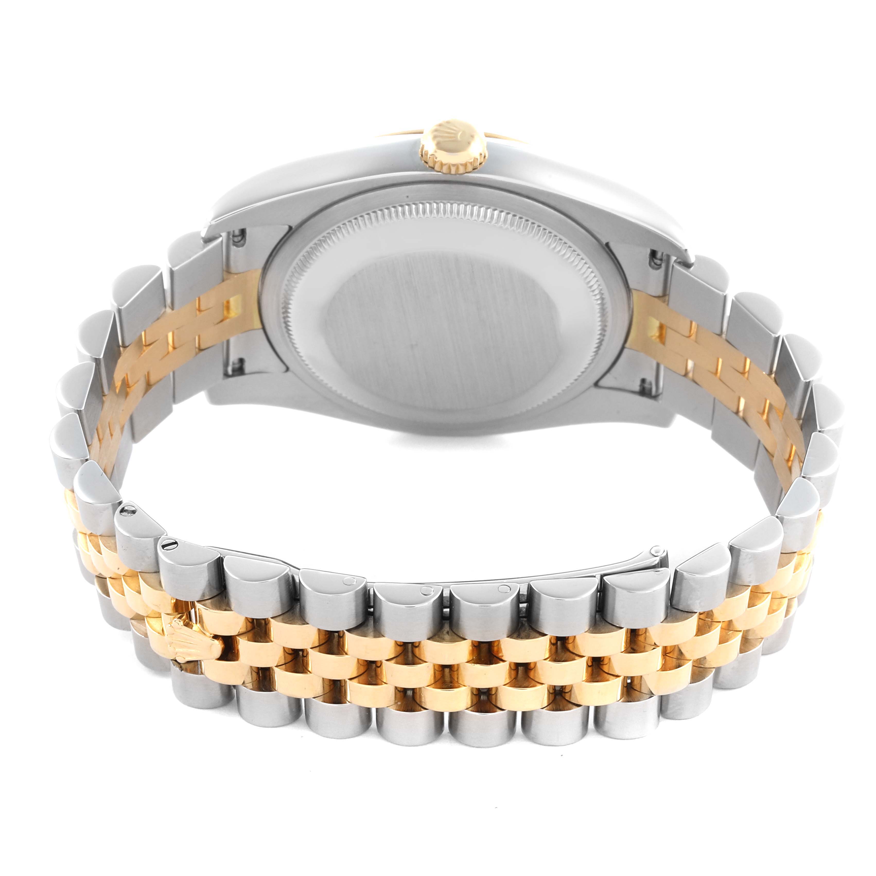 The image shows the back case and bracelet of a Rolex Datejust 116233 Men
s Steel and Gold (two tone) Champagne Dial 116233 Men
s Steel and Gold (two tone) Champagne Dial watch, highlighting its two-tone metal design.