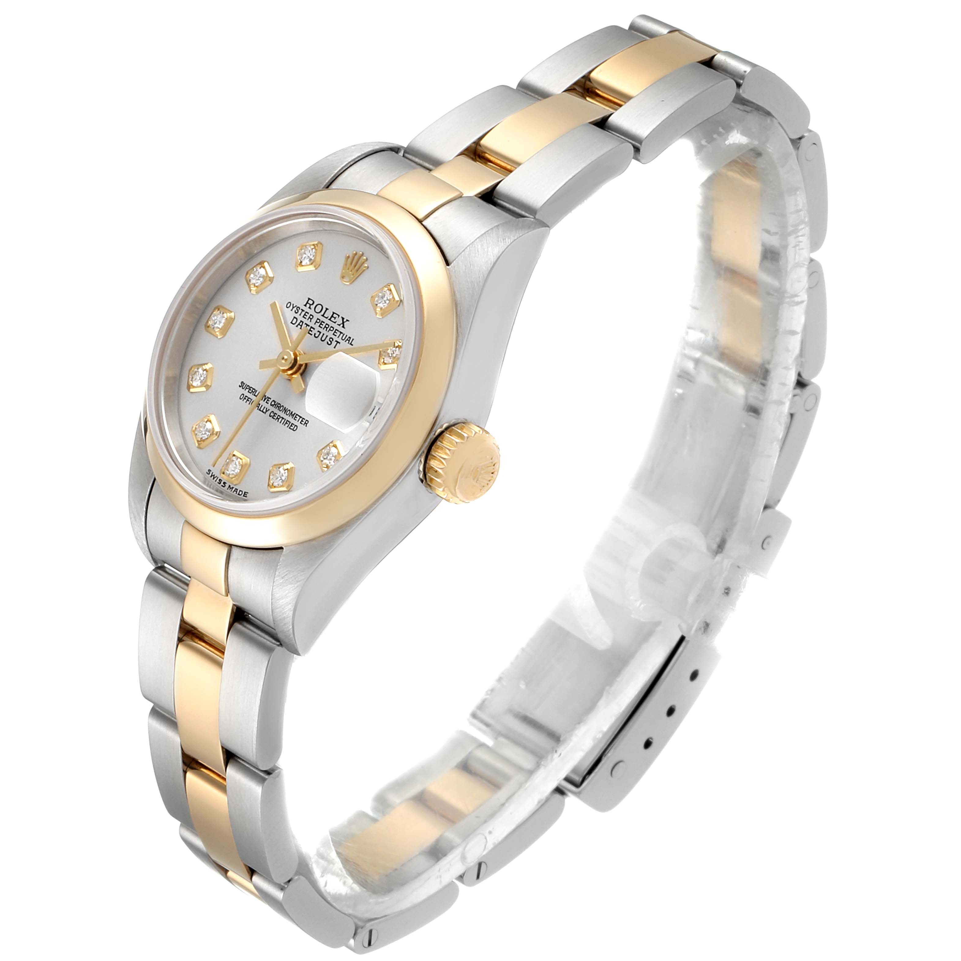 The Rolex Datejust 79163 Women's Steel and Gold (two tone) Silver Dial 79163 Women's Steel and Gold (two tone) Silver Dial watch is shown in a three-quarter view, highlighting its two-tone metal bracelet, bezel, and diamond hour markers.