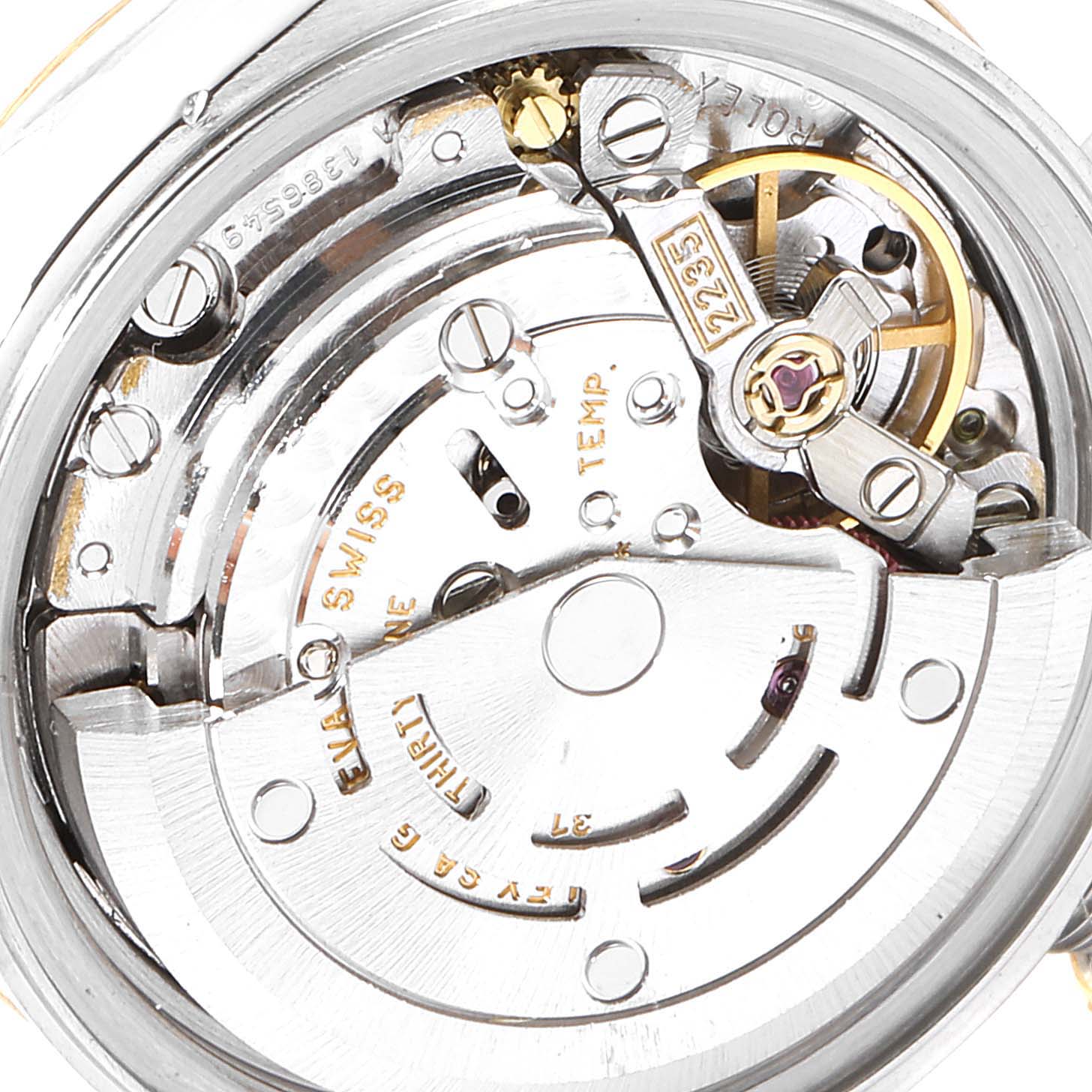 This image shows a close-up view of the Rolex Datejust 79163 Women's Steel and Gold (two tone) Silver Dial 79163 Women's Steel and Gold (two tone) Silver Dial's internal movement and components from the back.