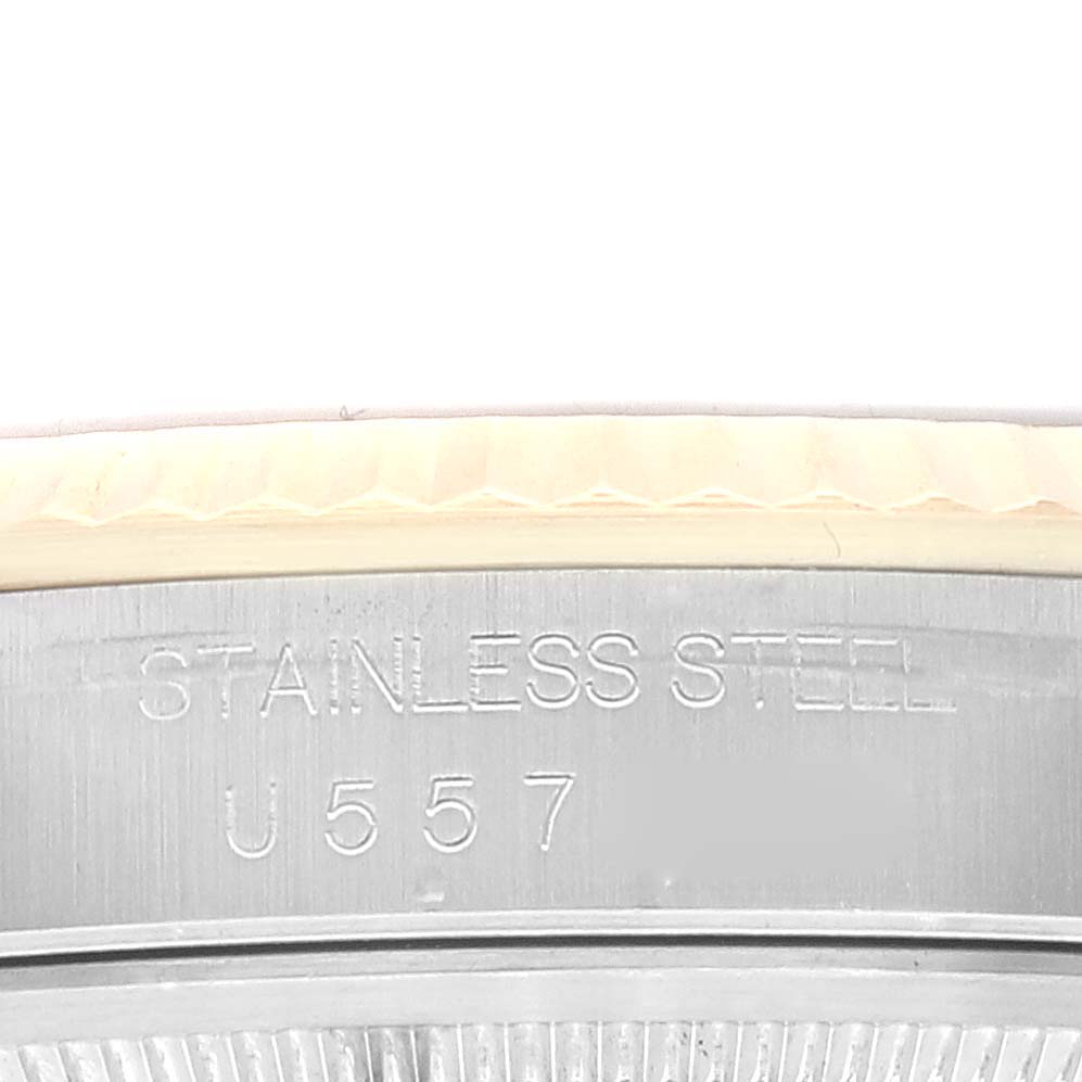 This image shows a close-up view of the stainless steel case back with markings of a Rolex Datejust 16233 Men's Steel and Gold (two tone) Mother of Pearl Dial 16233 Men's Steel and Gold (two tone) Mother of Pearl Dial watch.