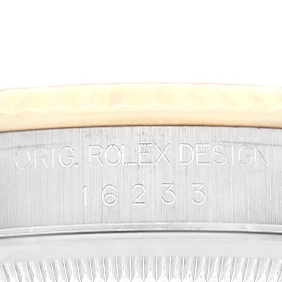 This image shows a close-up of the case-back edge of a Rolex Datejust 16233 Men's Steel and Gold (two tone) Mother of Pearl Dial 16233 Men's Steel and Gold (two tone) Mother of Pearl Dial watch, with the model number 16233 engraved.