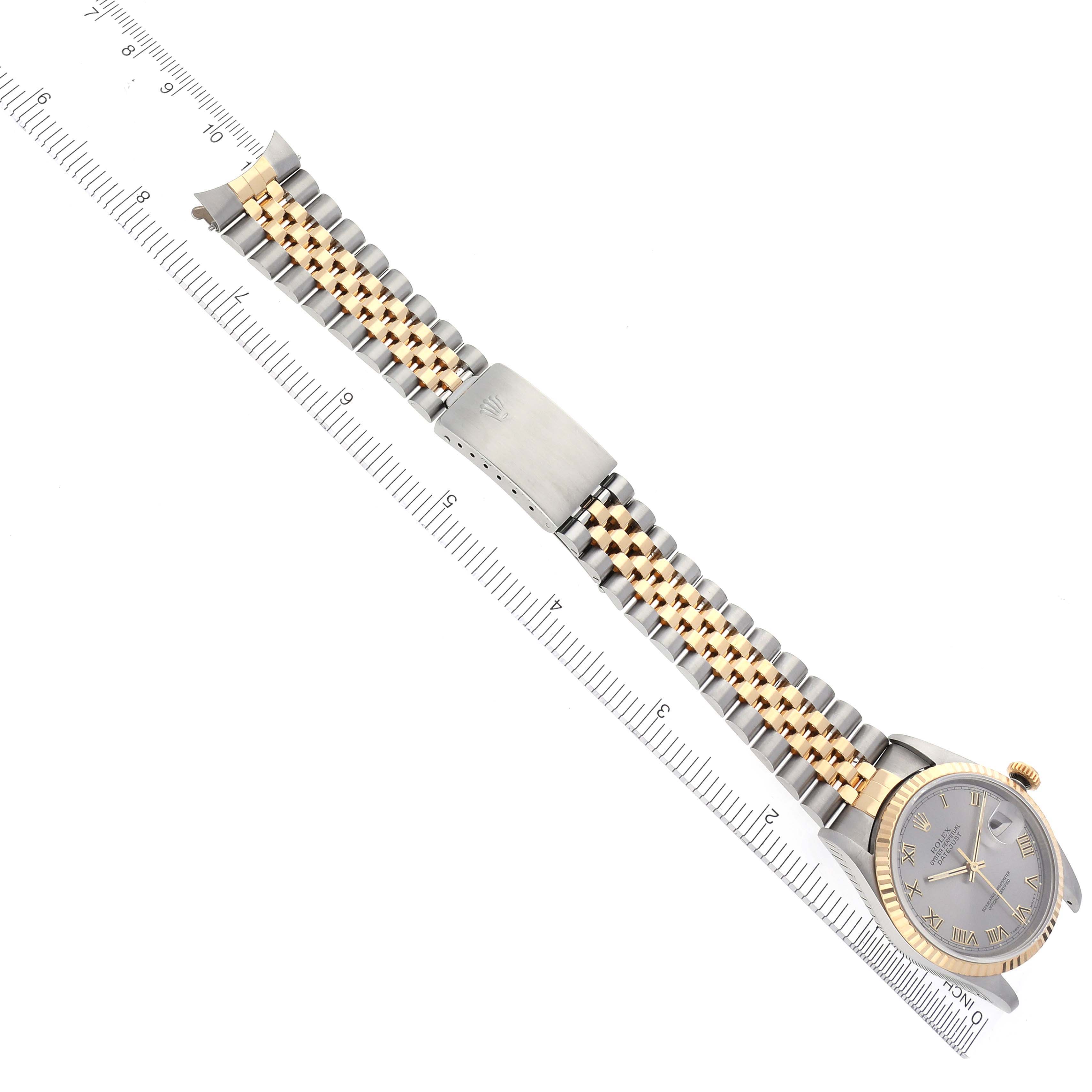 The Rolex Datejust 16233 Men's Steel and Gold (two tone) Grey Dial 16233 Men's Steel and Gold (two tone) Grey Dial watch is shown from a top-down angle, displaying the face, bezel, and two-tone bracelet with a clasp.